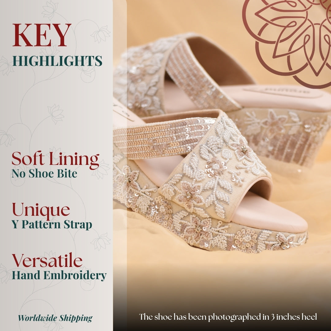 Ivory platform sandal with intricate sequin embroidery and Y pattern strap