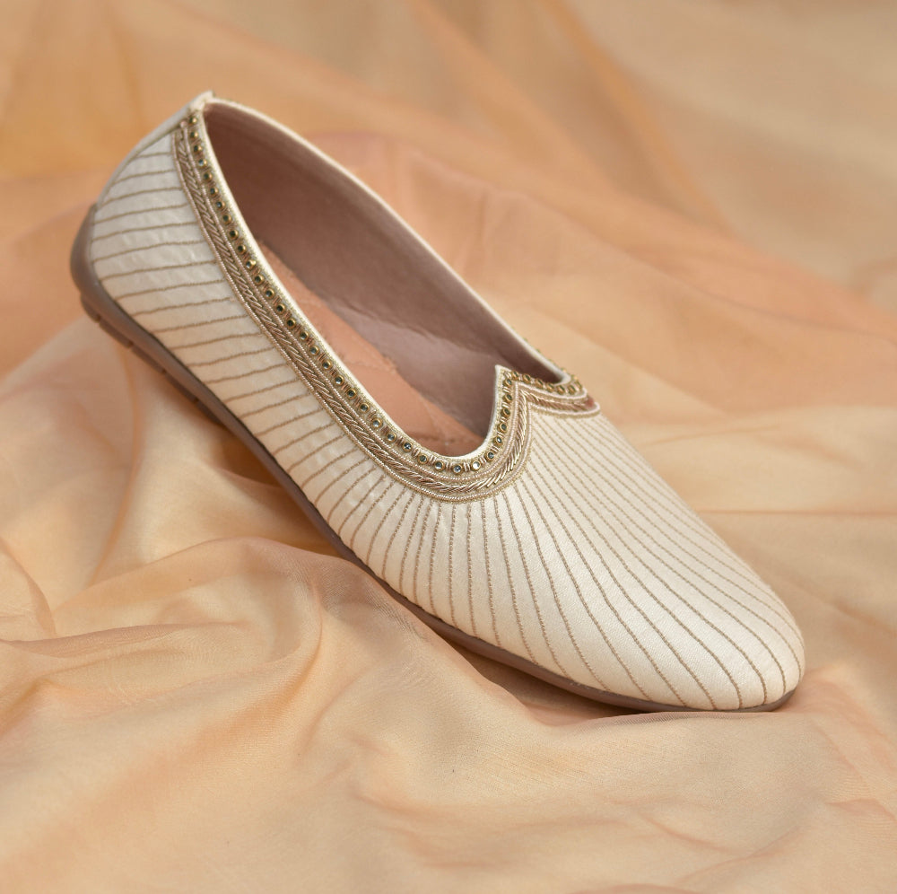 Minimal soft ivory mojri featuring linear texture and embellished border