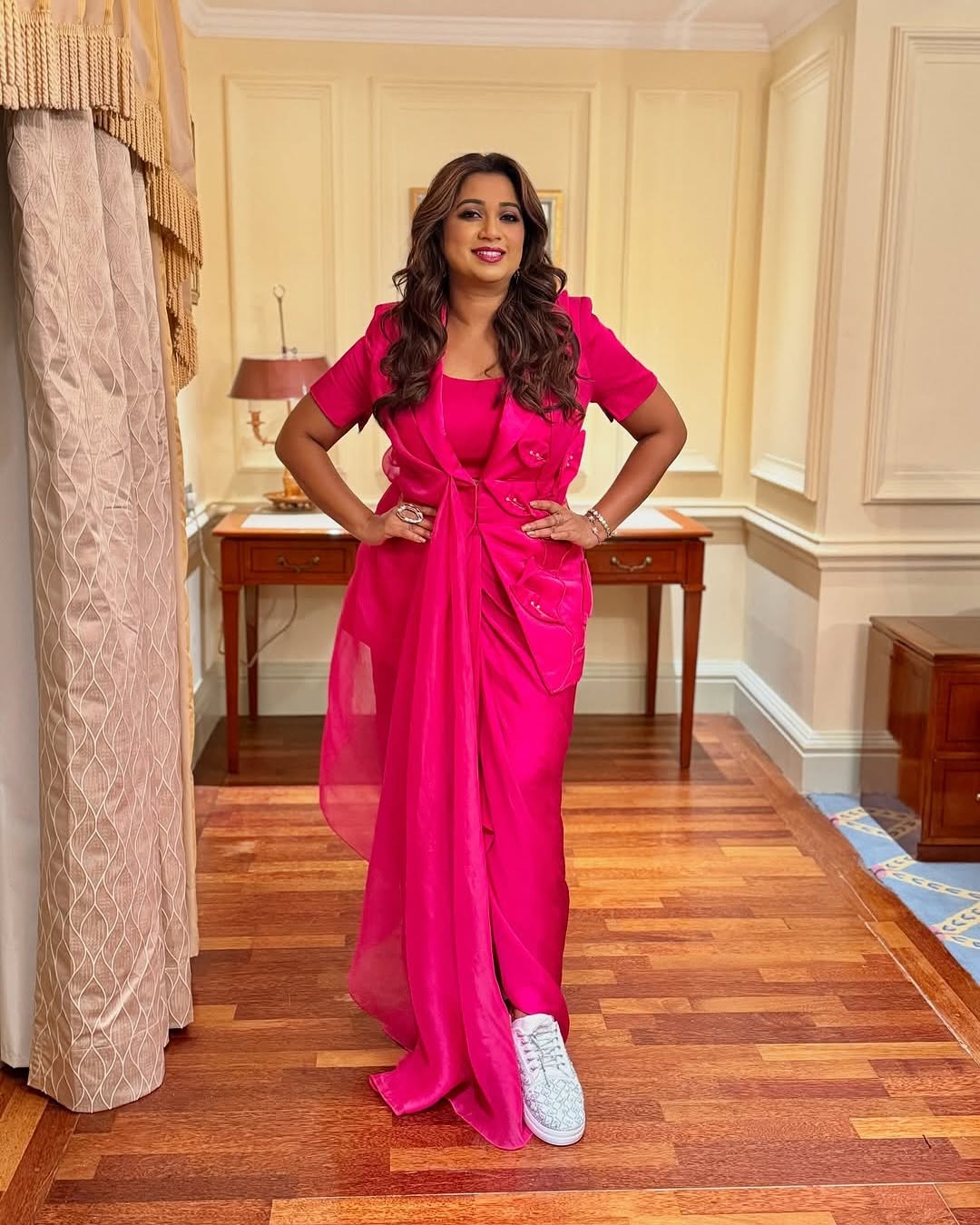 Singer Shreya Ghoshal wearing silver sneakers