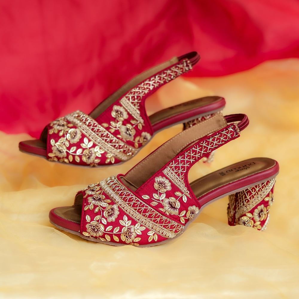 Festive crimson block heel sandals with floral threadwork and slingback strap
