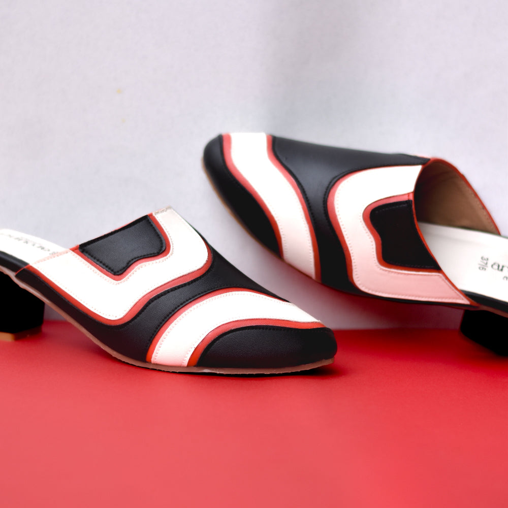 Statement mule heel in black, ivory, and red tones
