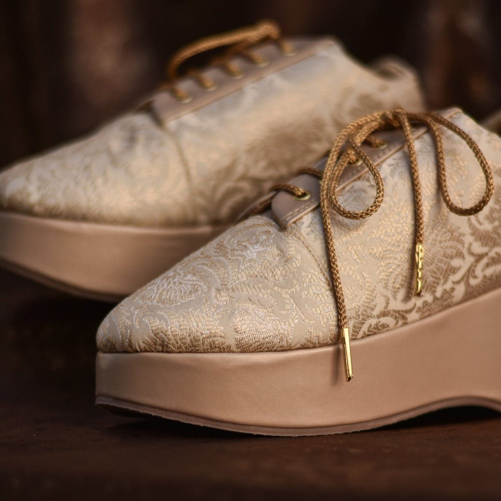 Festive beige brocade sneaker wedge with golden laces. Handmade and cushioned wedding shoes.