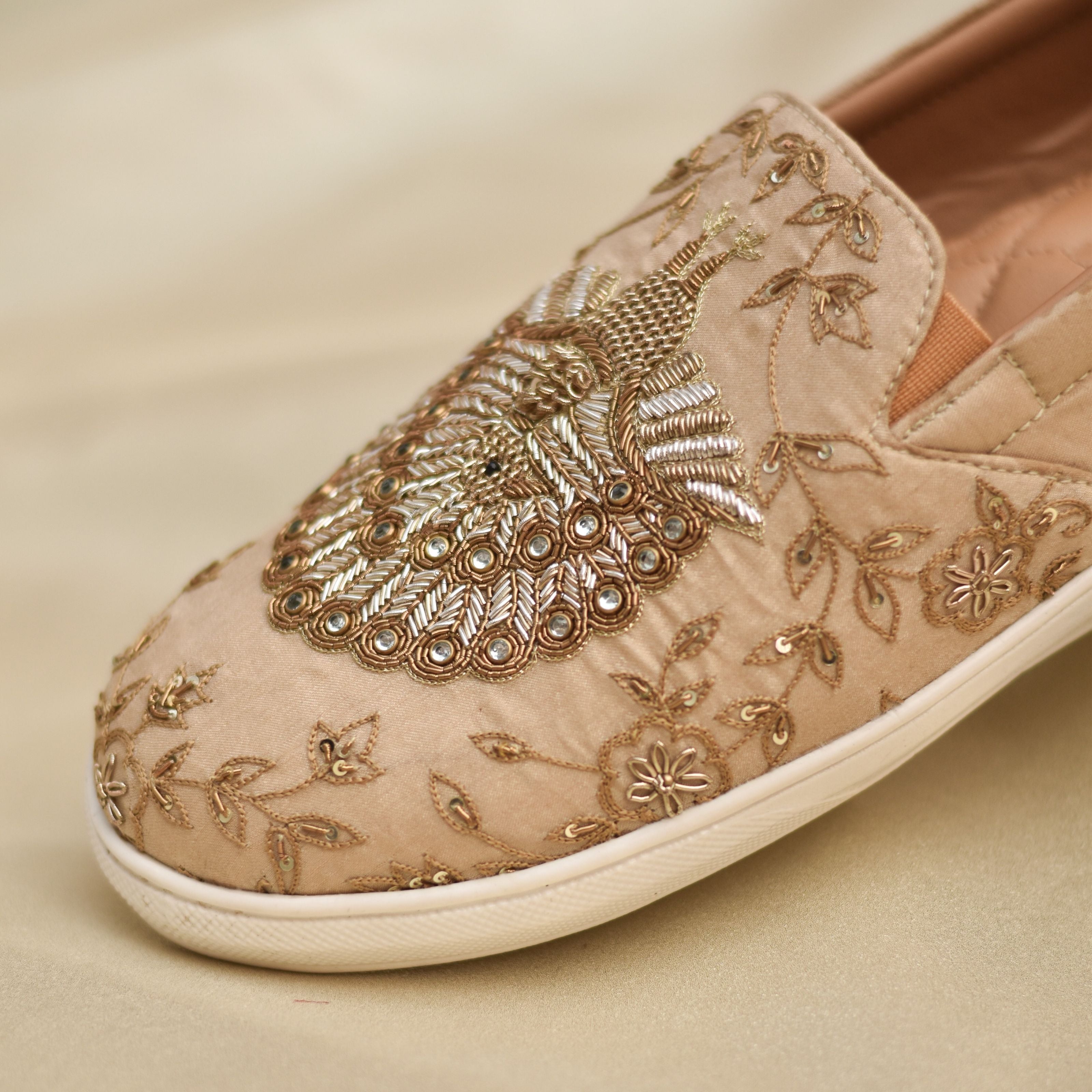 Festive occasion slip-ons for men showcasing traditional zardozi embroidery and white sole.