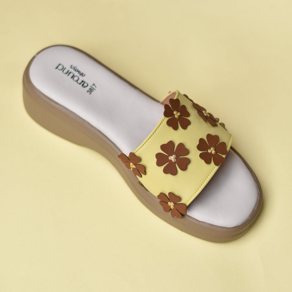 Platform slides featuring mirrored caramel and yellow floral straps