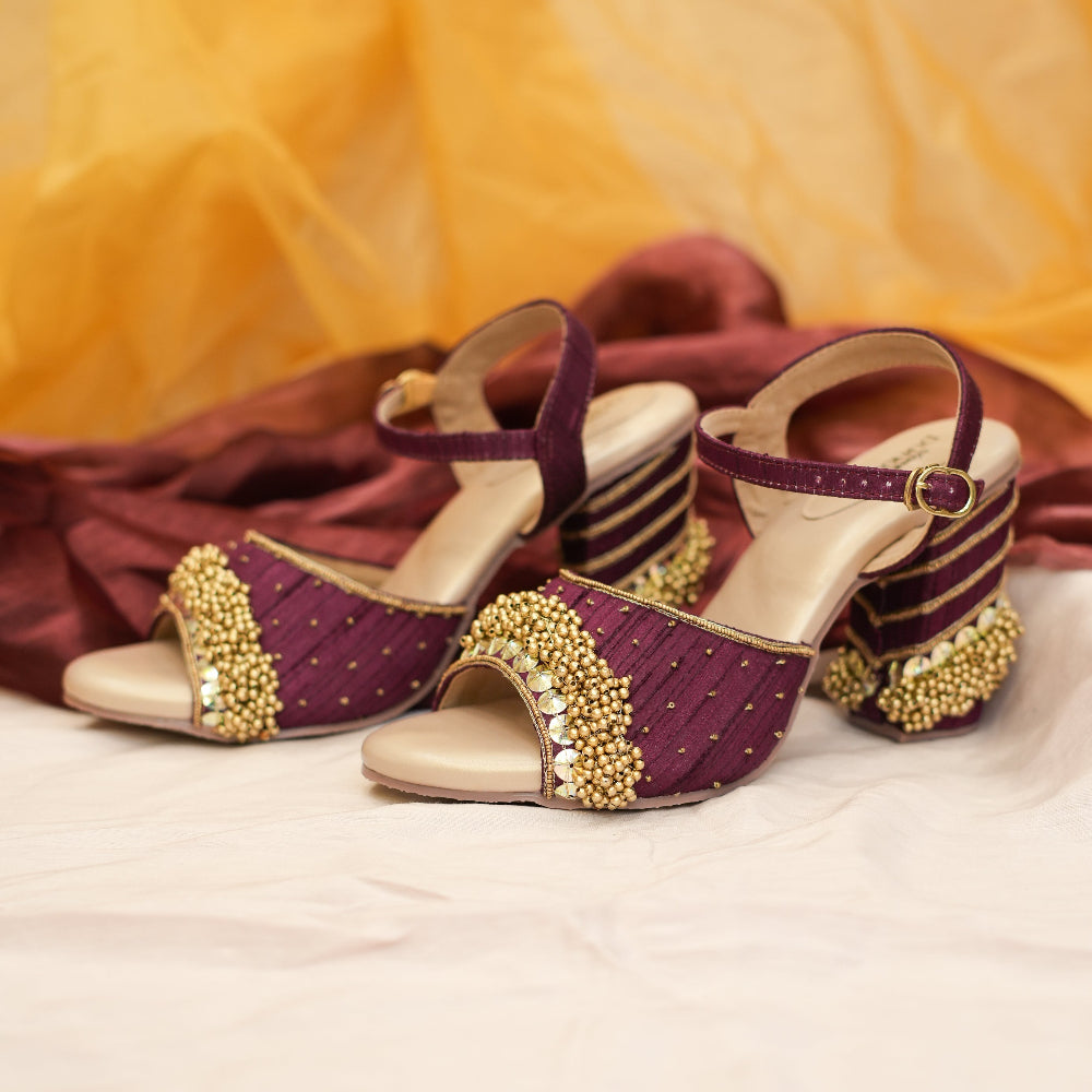 Maroon bridal wedges with ornate gold front detailing
