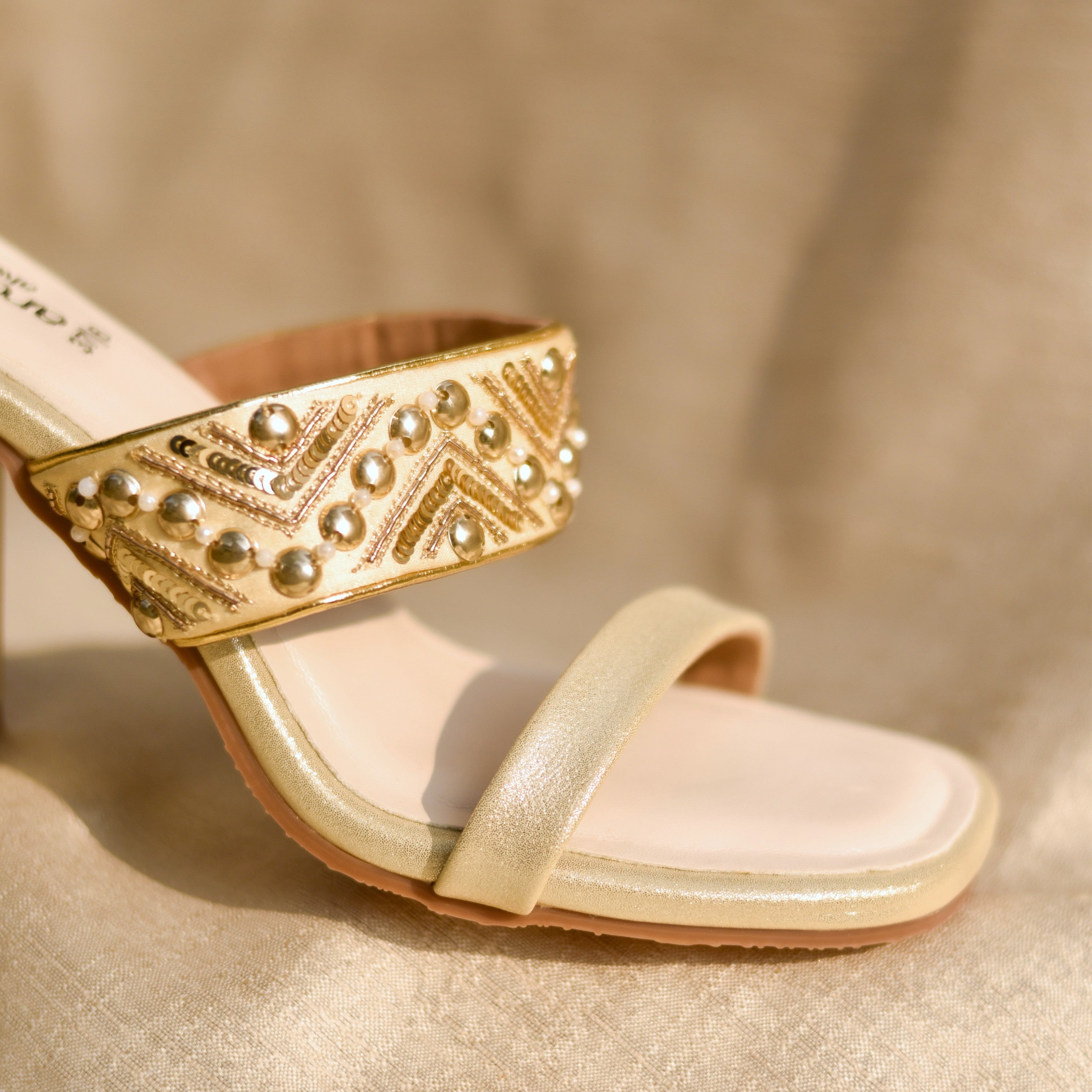 Golden ivory ethnic sandals with subtle shimmer for wedding and festive celebrations