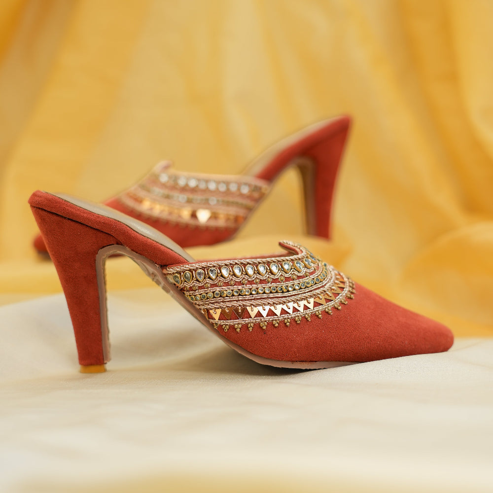 Red block heel sandals with intricate gold floral embroidery
