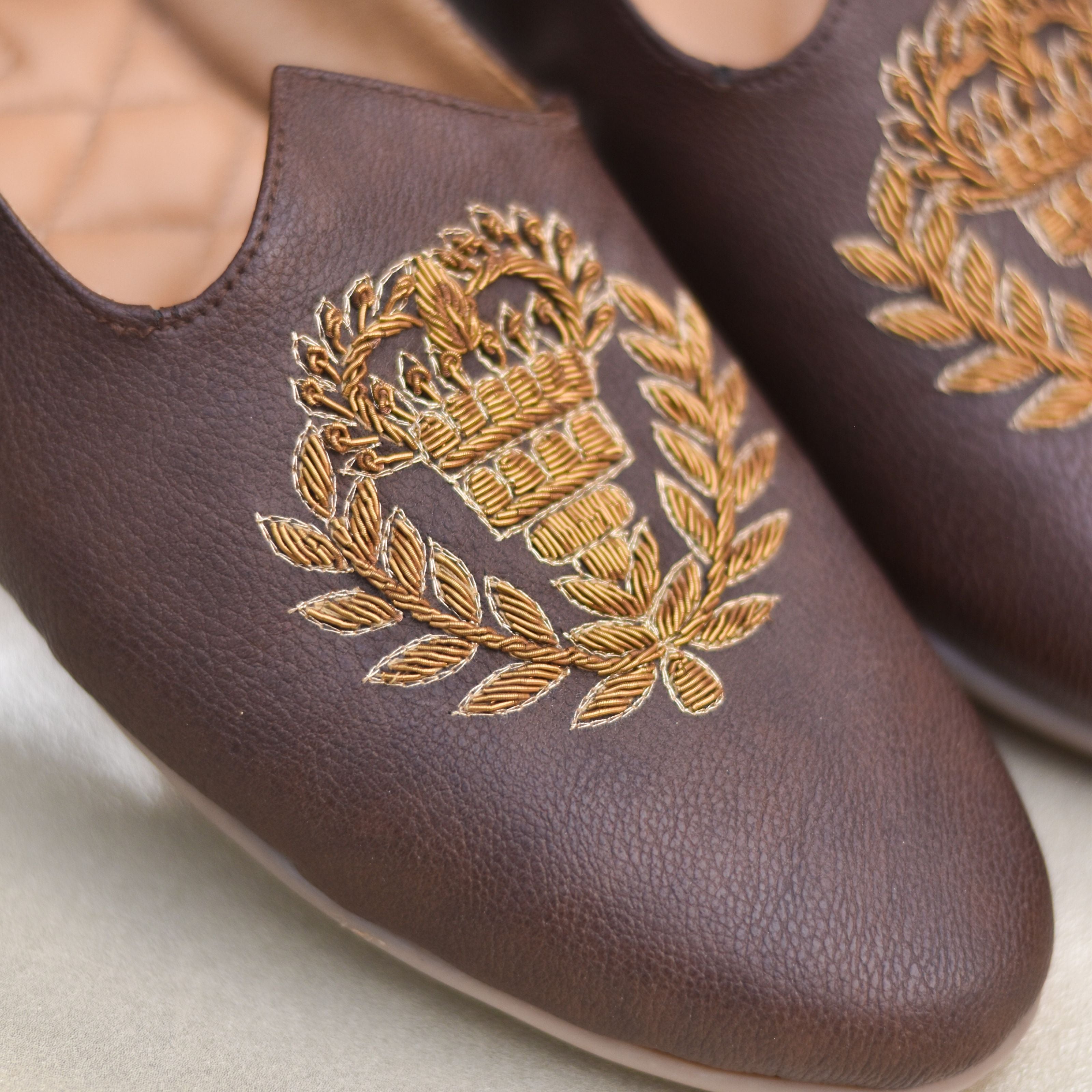 Ethnic wedding shoes for men with crown design and handcrafted stitchwork.