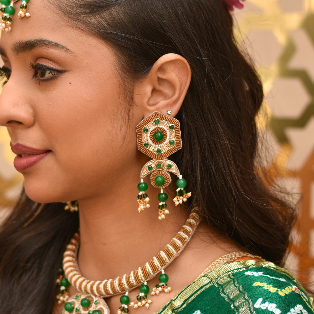 Ornate green and gold jewelry with a unique shape earrings for the bride
