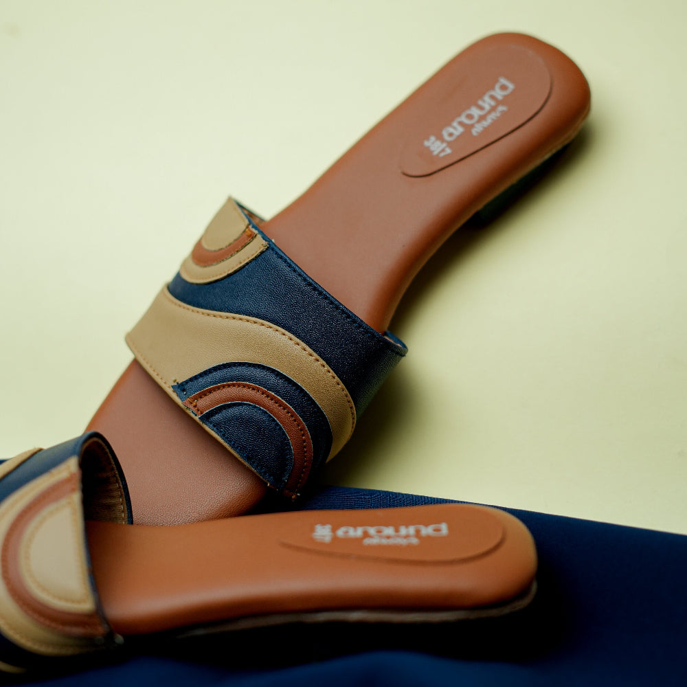 Women’s open-toe tan and navy sandals with low heel