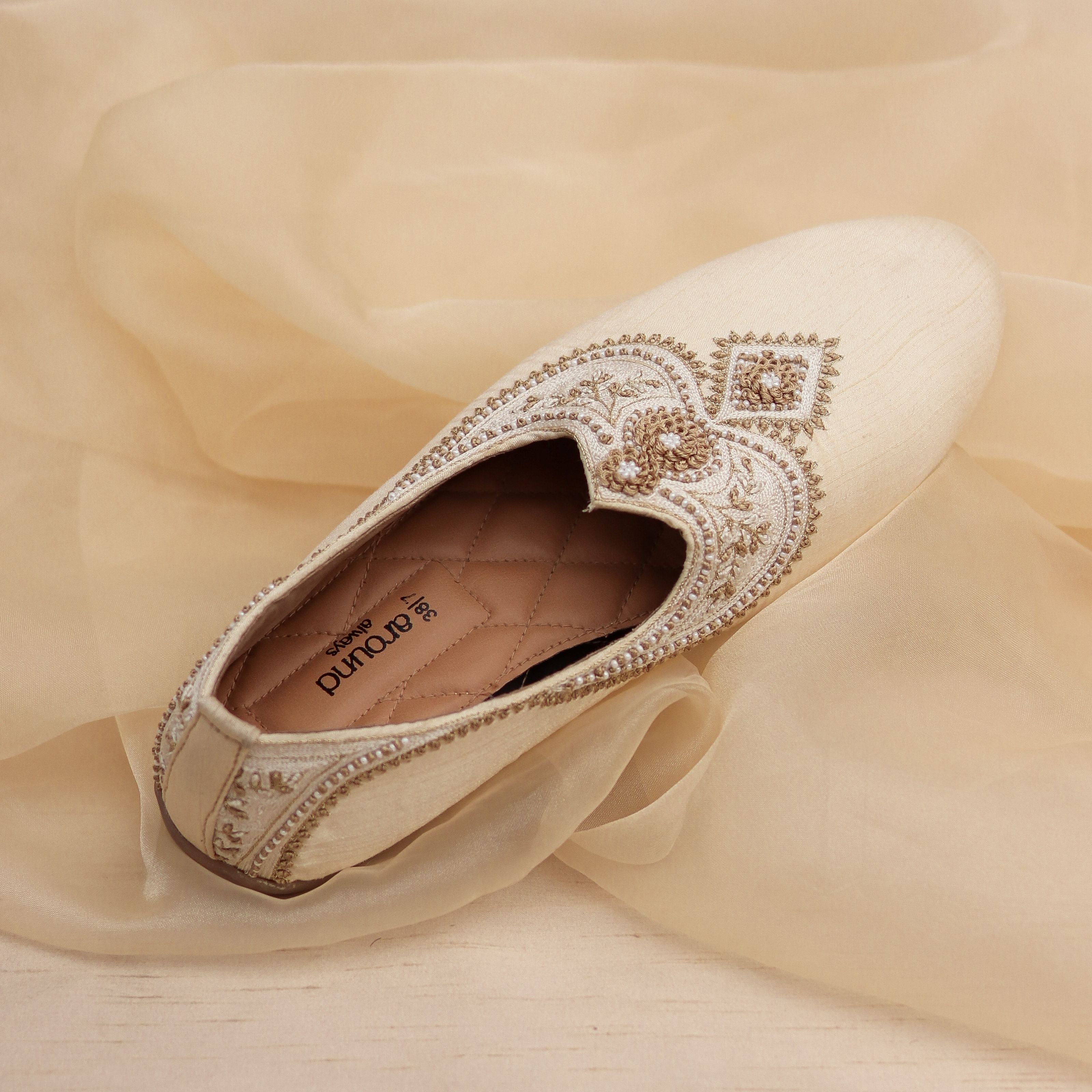 Traditional wedding mojris with hand embroidery and soft cushioning.