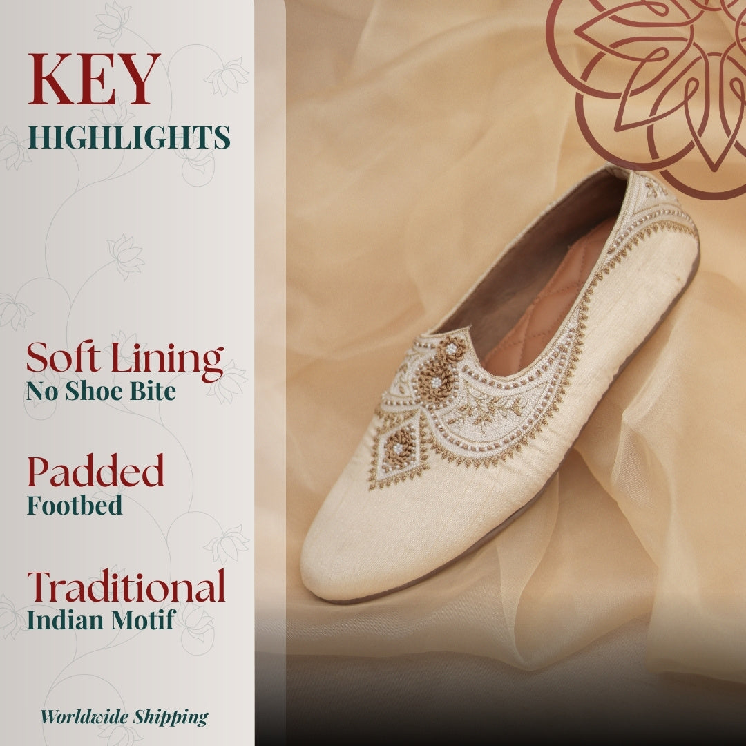 Beige embroidered mojri with intricate traditional detailing