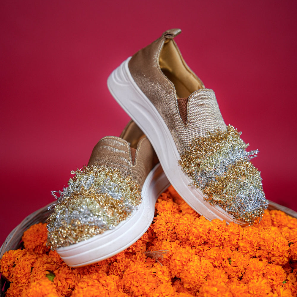 Festive champagne slip-on featuring alternating metallic textile bands
