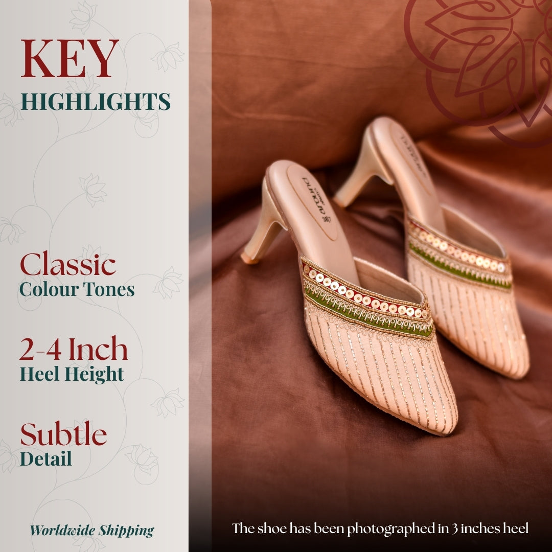 Handcrafted embroidered mules with pencil heel, structured shape and understated elegance