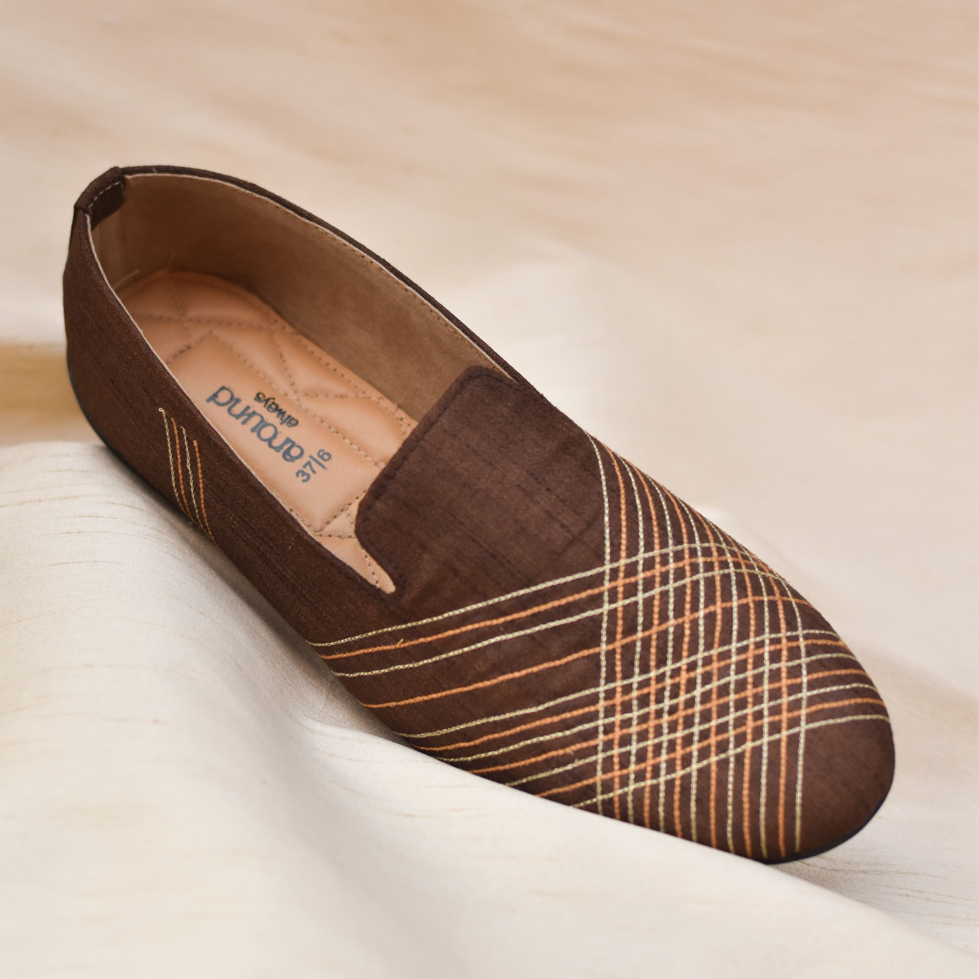 Men's wedding slip-ons in deep chocolate with modern stitched pattern.