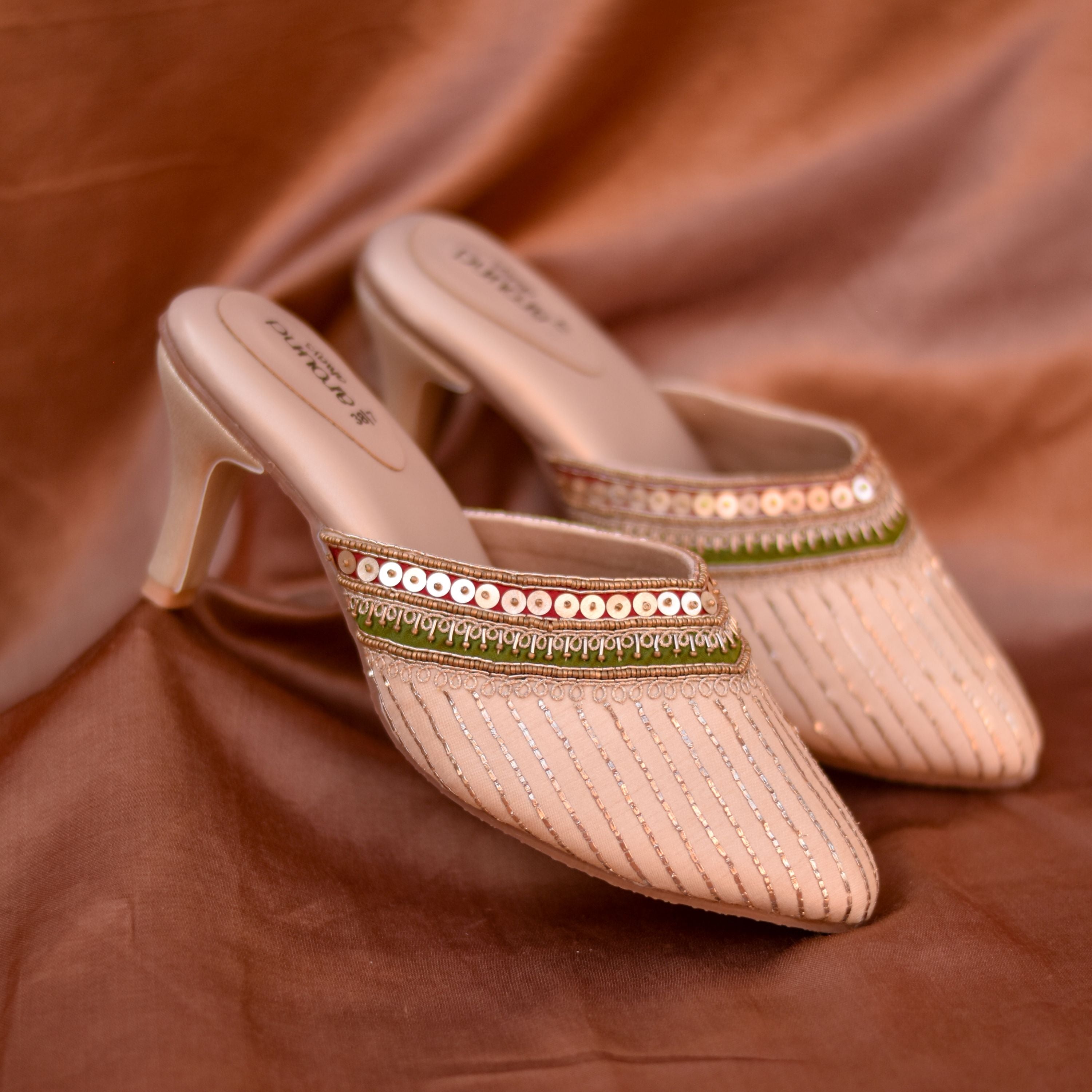 Shimmer striped golden heels styled for weddings and festive events.