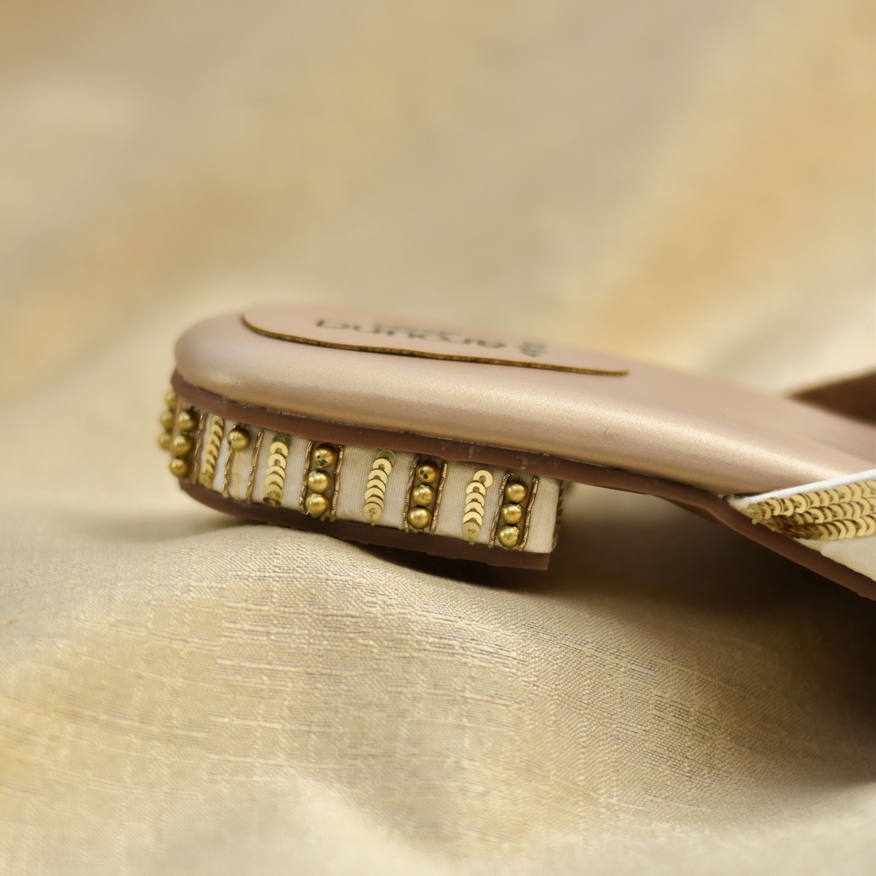 Ivory party shoes for women with gold detailing and comfort insole.