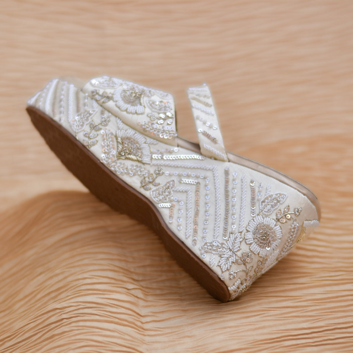 Designer Indian wedding heels in muted colour and hand-embroidered surfaces 