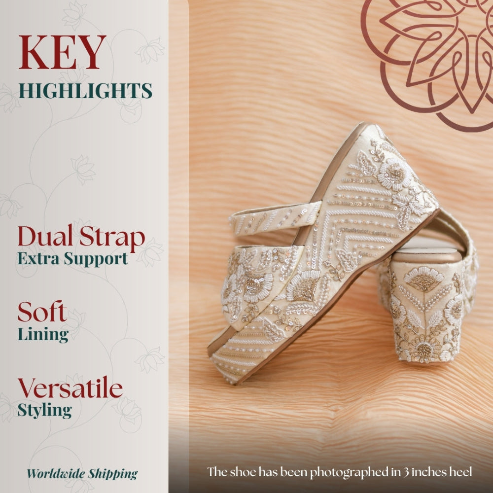 Elegant off white heels featuring intricate beadwork, geometric patterns