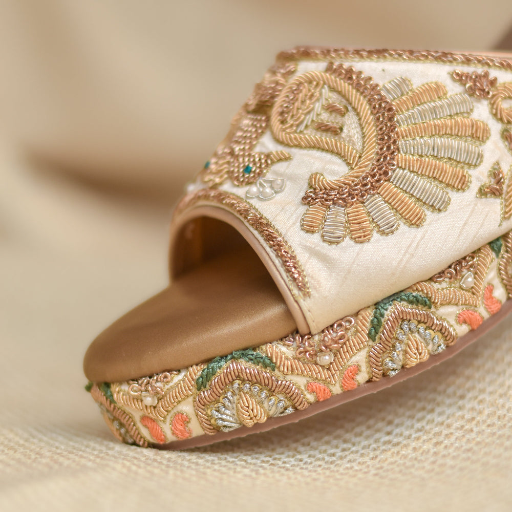 Festive platform sandals with embroidered peacock design and floral printed heel