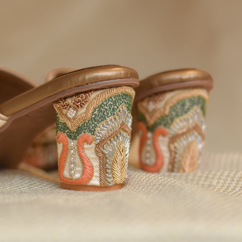 Hand-embroidered peacock platform heels with ornate multicolour heel detailing