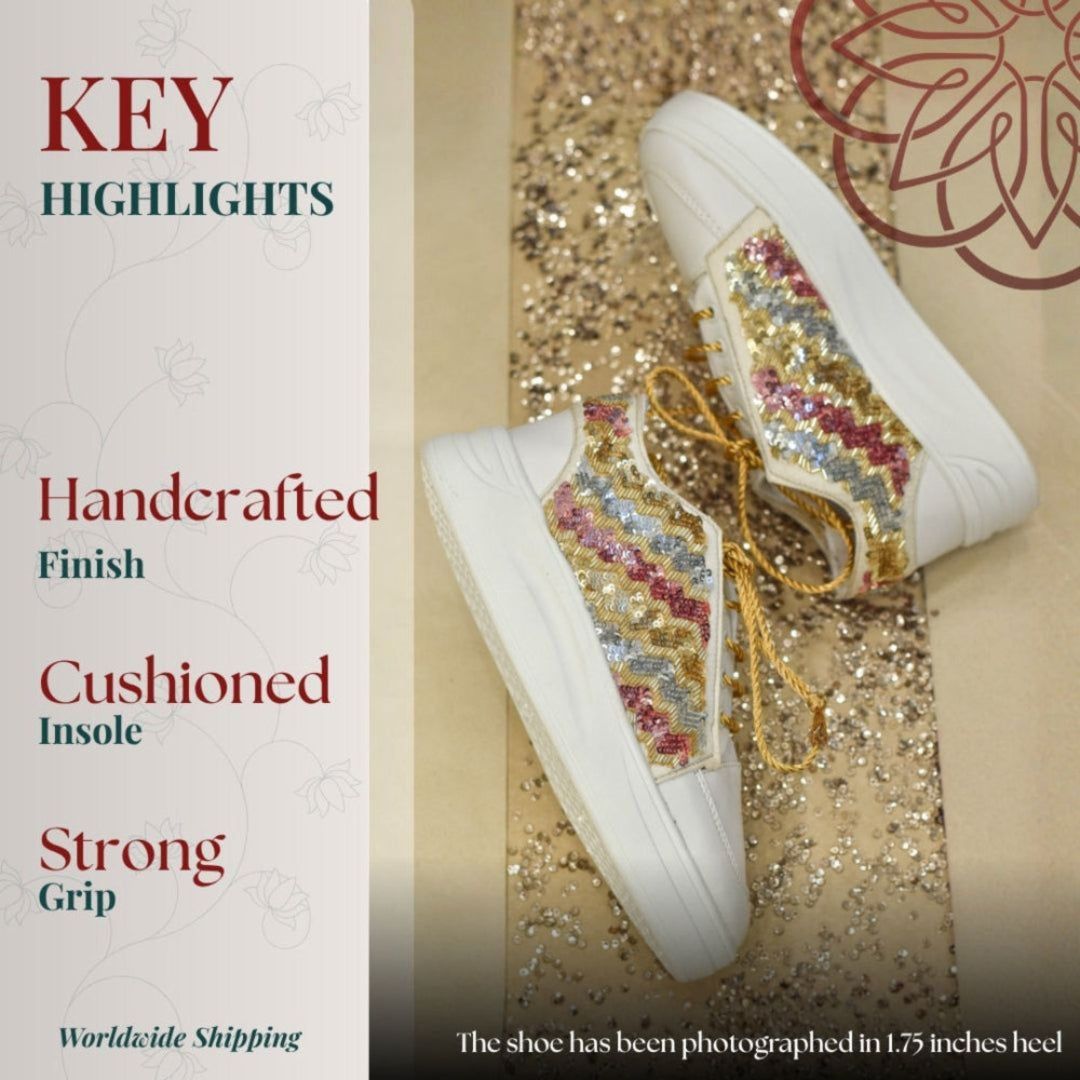 Contemporary sneakers with gold accents and vibrant embroidered wave pattern