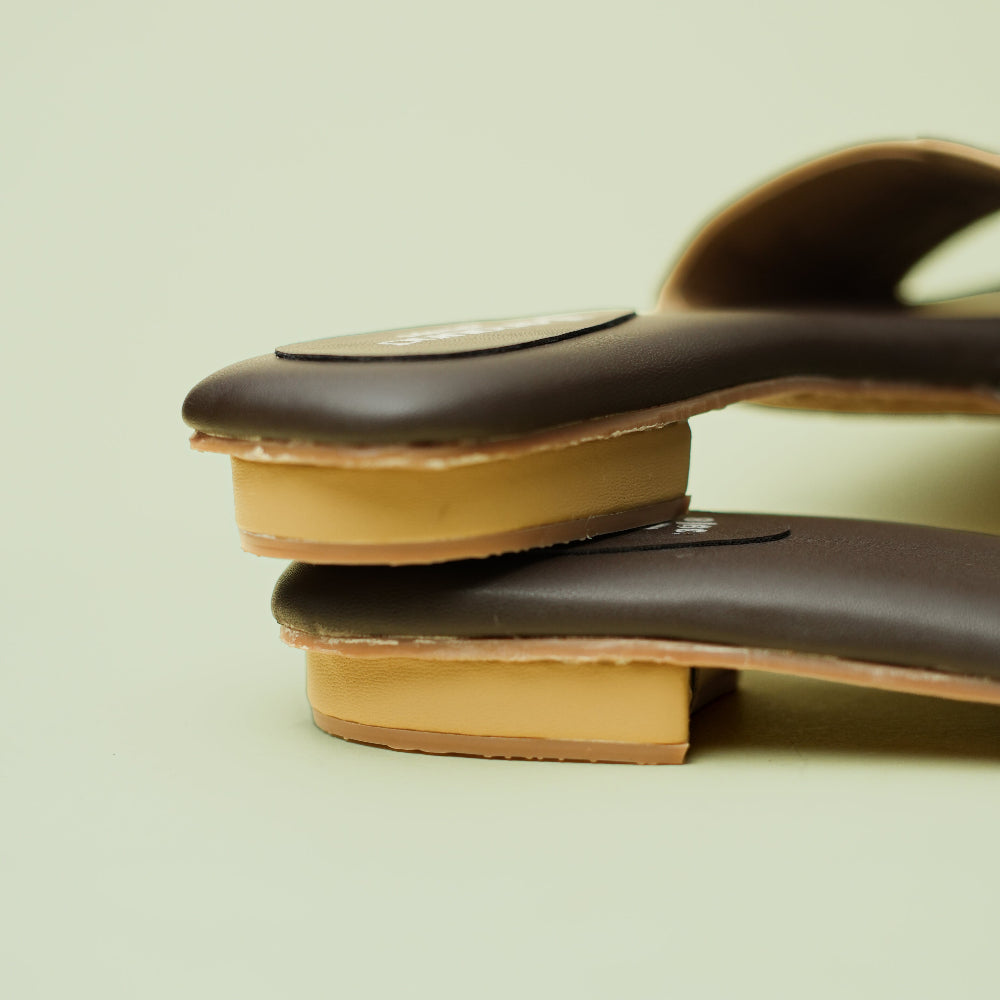 Beige and black statement slide sandal by Around Always