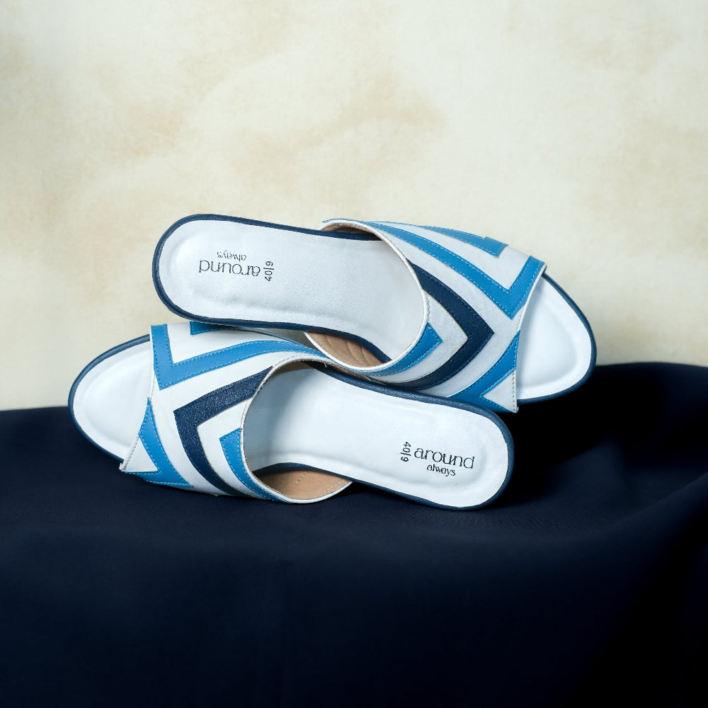 Minimal white mule with navy and bright blue accents