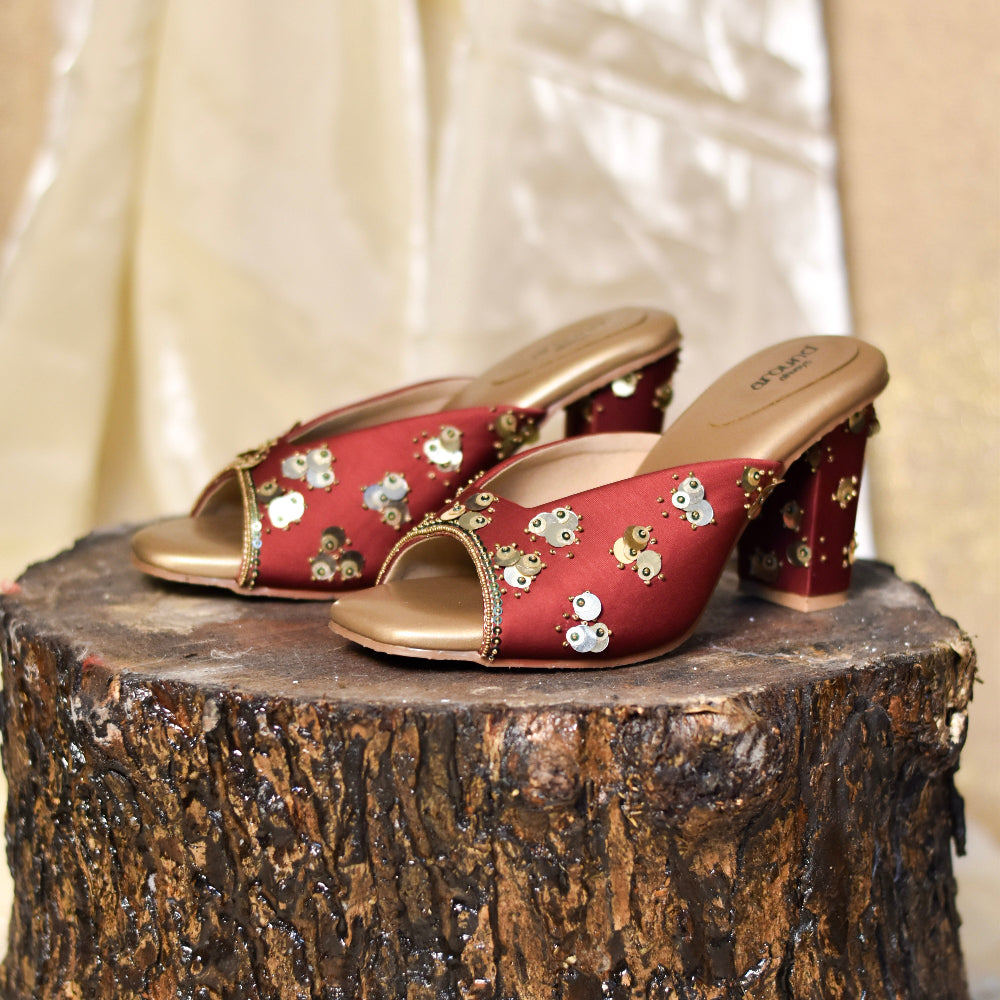 Open toe mule footwear in red with metallic accents
