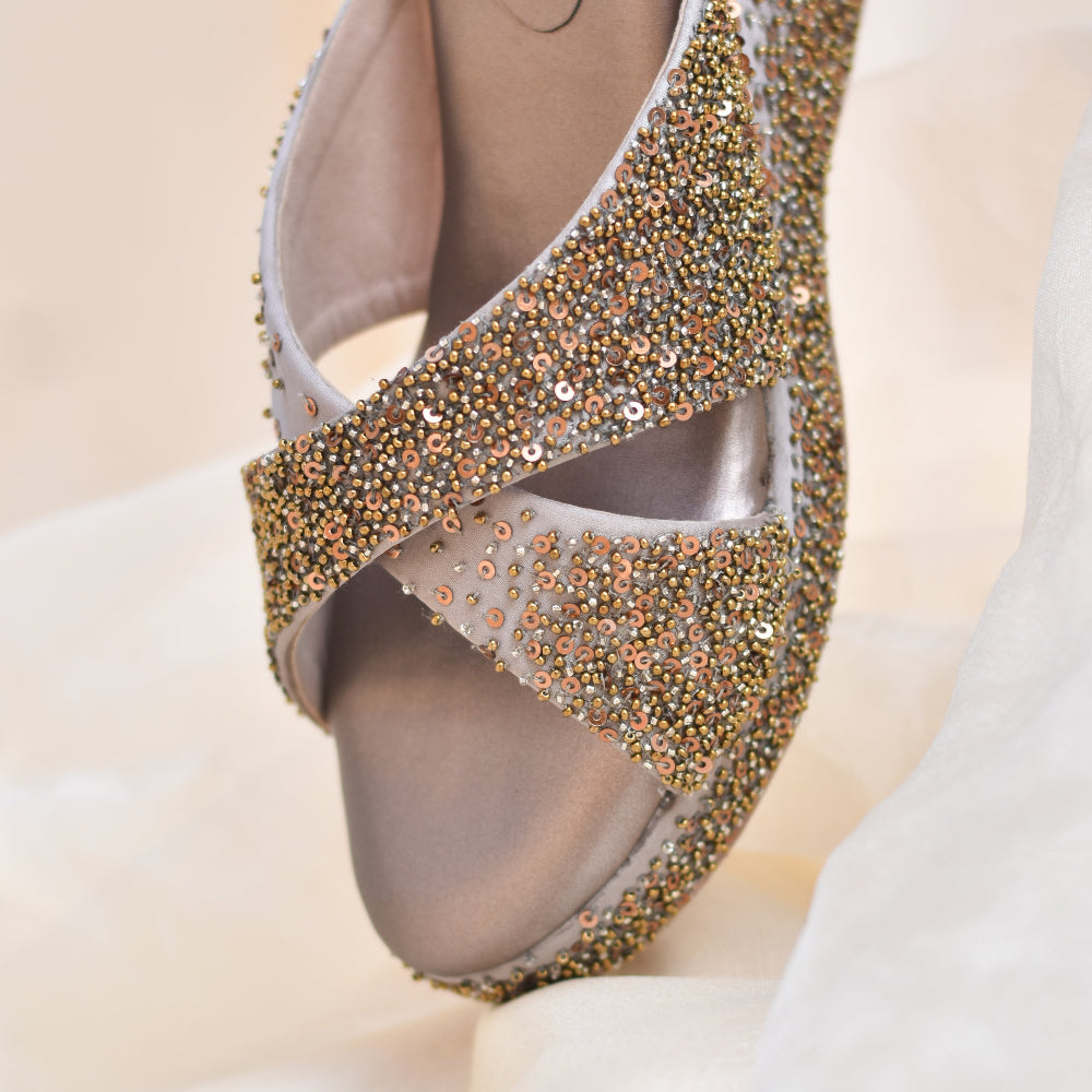 Silver grey platform wedges with dense sequin scatter on straps and base