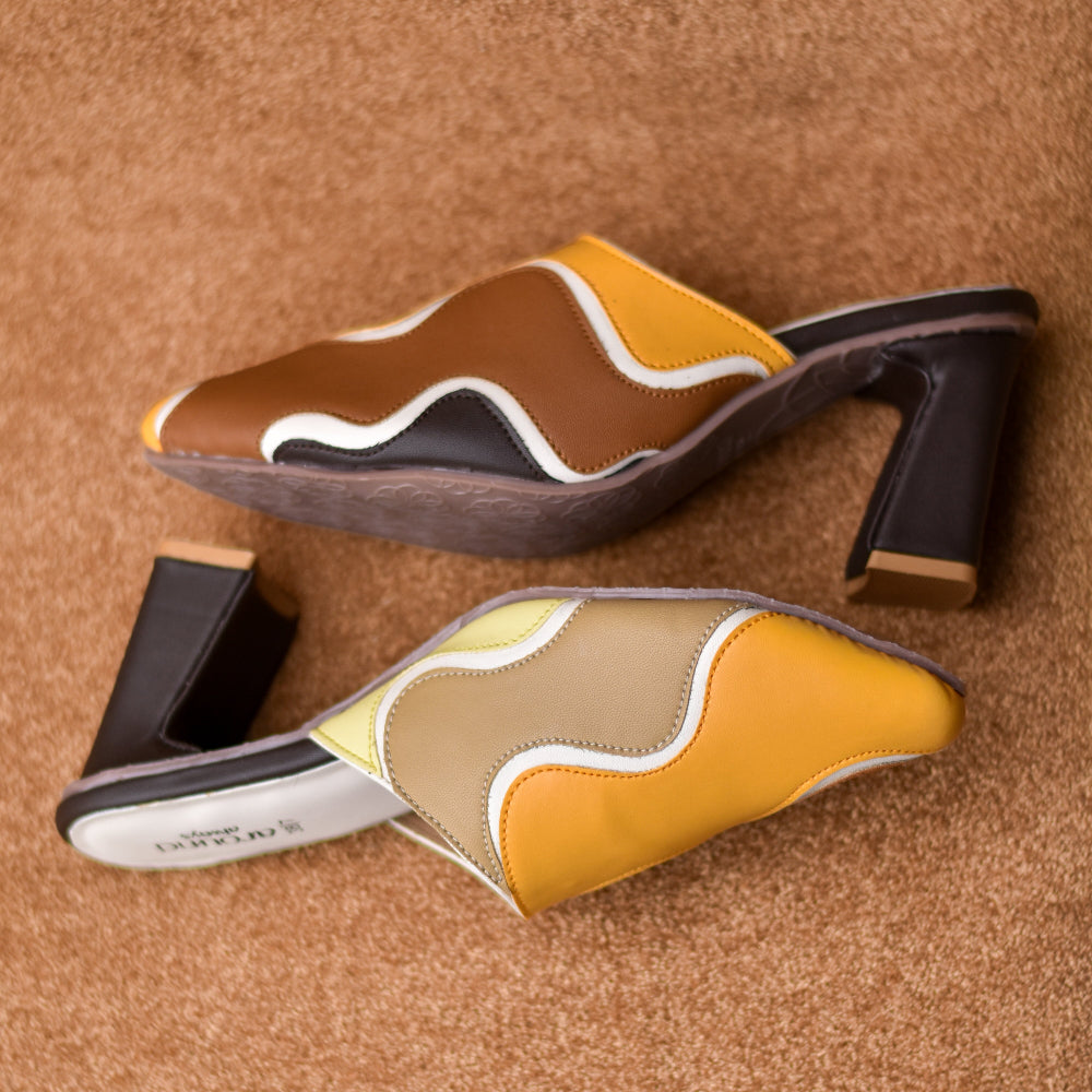 Modern colour-block mule featuring curved panel design and lightweight construction