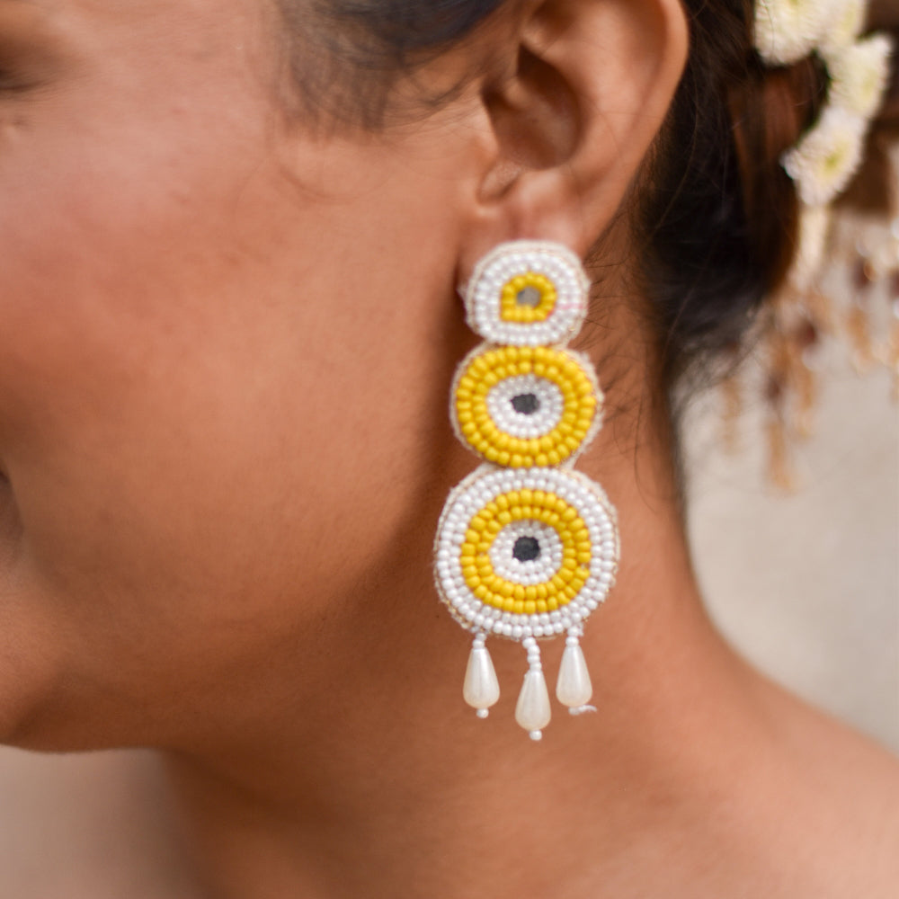Light weight yellow and white beaded earrings designed for haldi functions