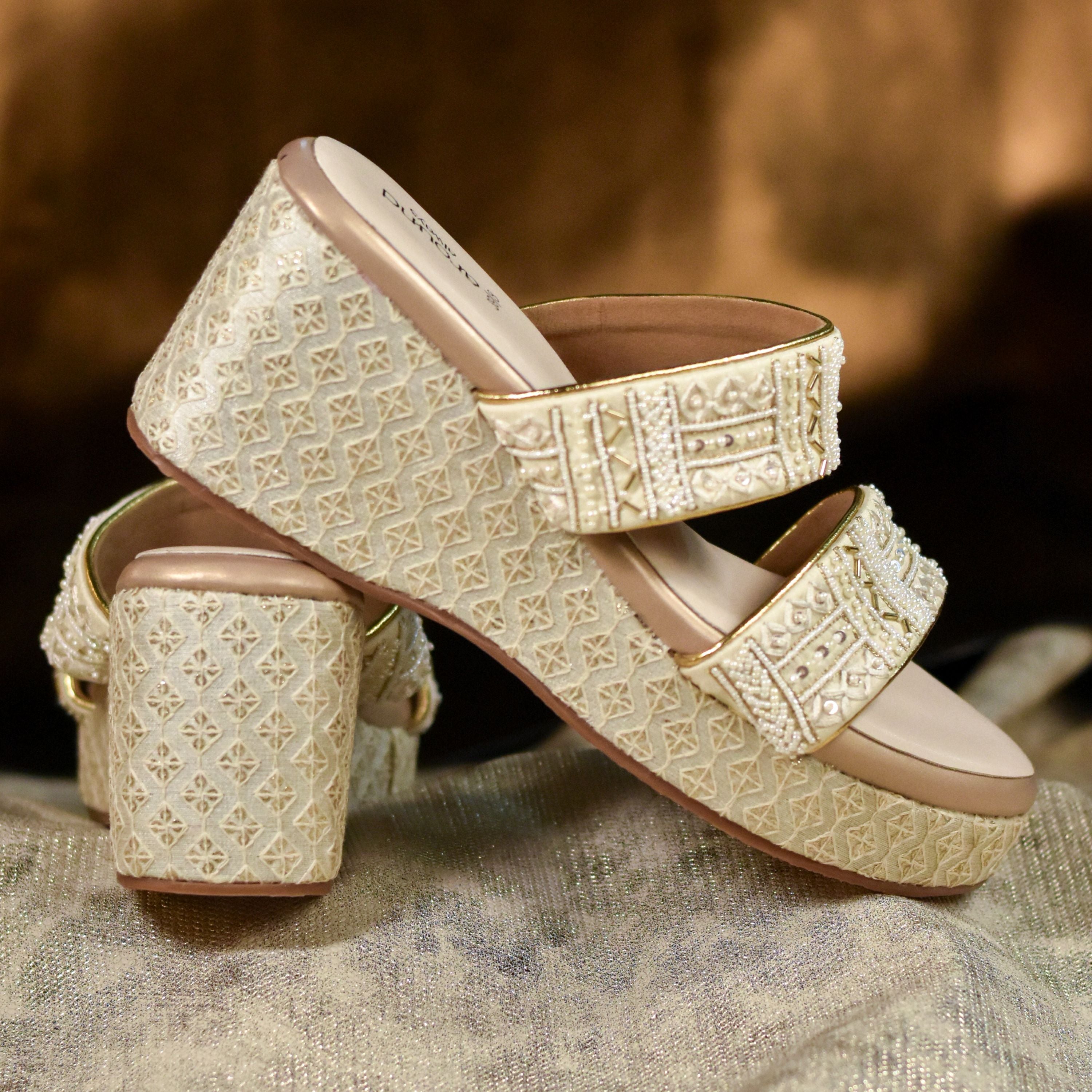 Embellished gold wedges featuring bead and sequin detailing.