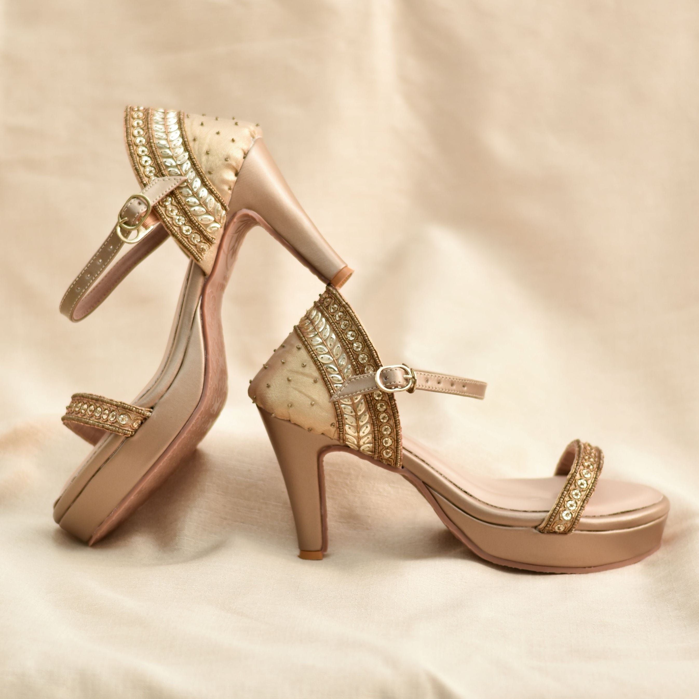 Gold platform heels with sequins work straps and ankle buckle.
