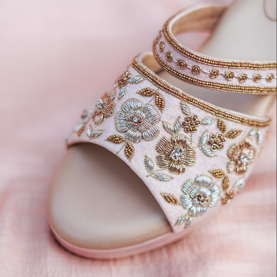 Soft colour wedges with fine zari work floral pattern