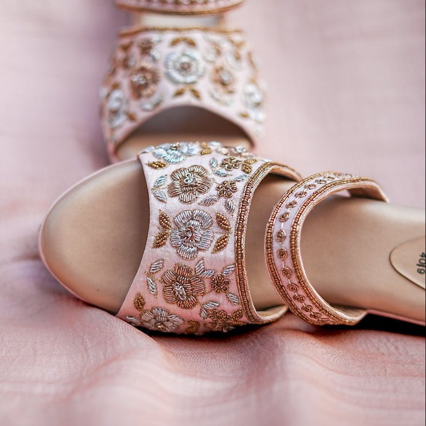 Festive wedges with intricate threadwork flowers and a comfortable raised base