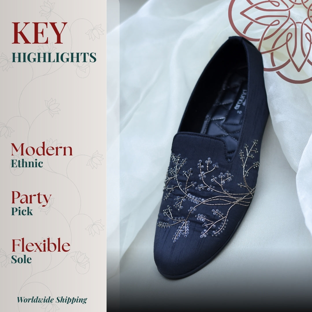 Dark ethnic loafers featuring delicate vine embroidery