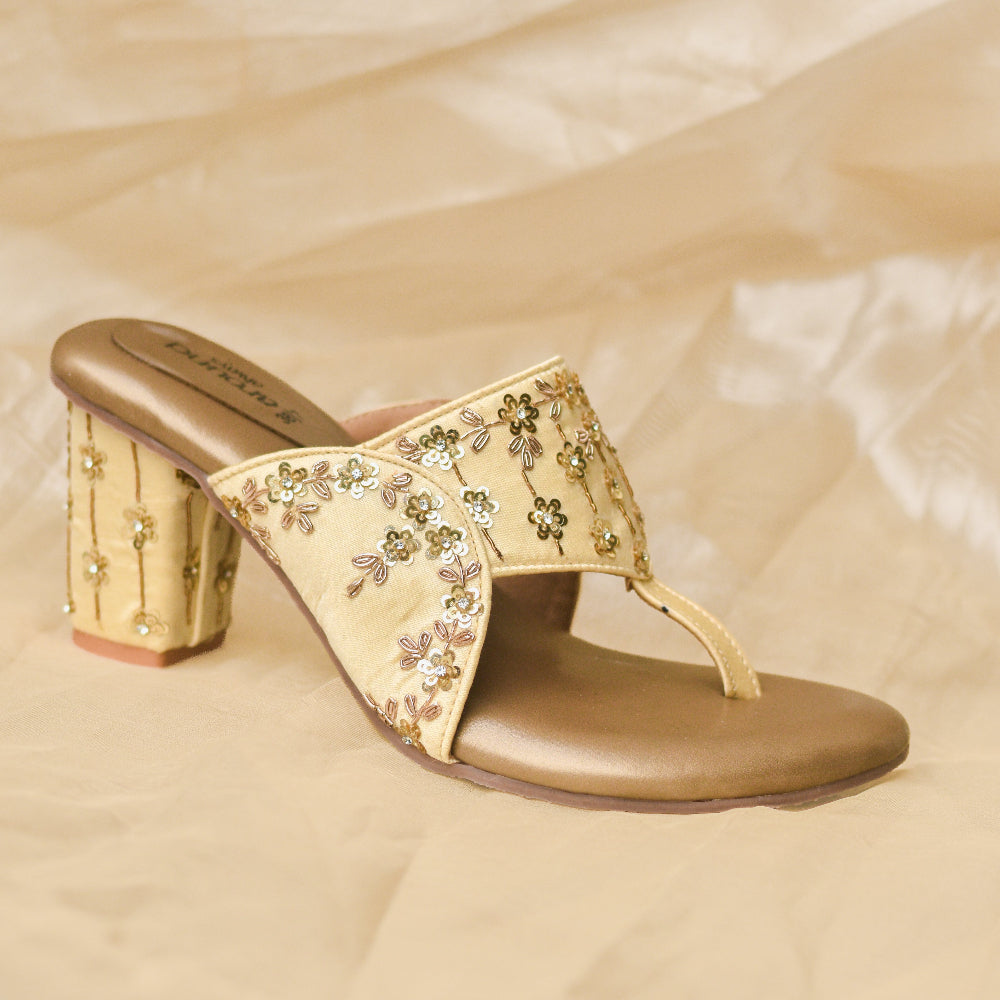 Gold floral toe-ring block heels with hand-finished sequin detailing.
