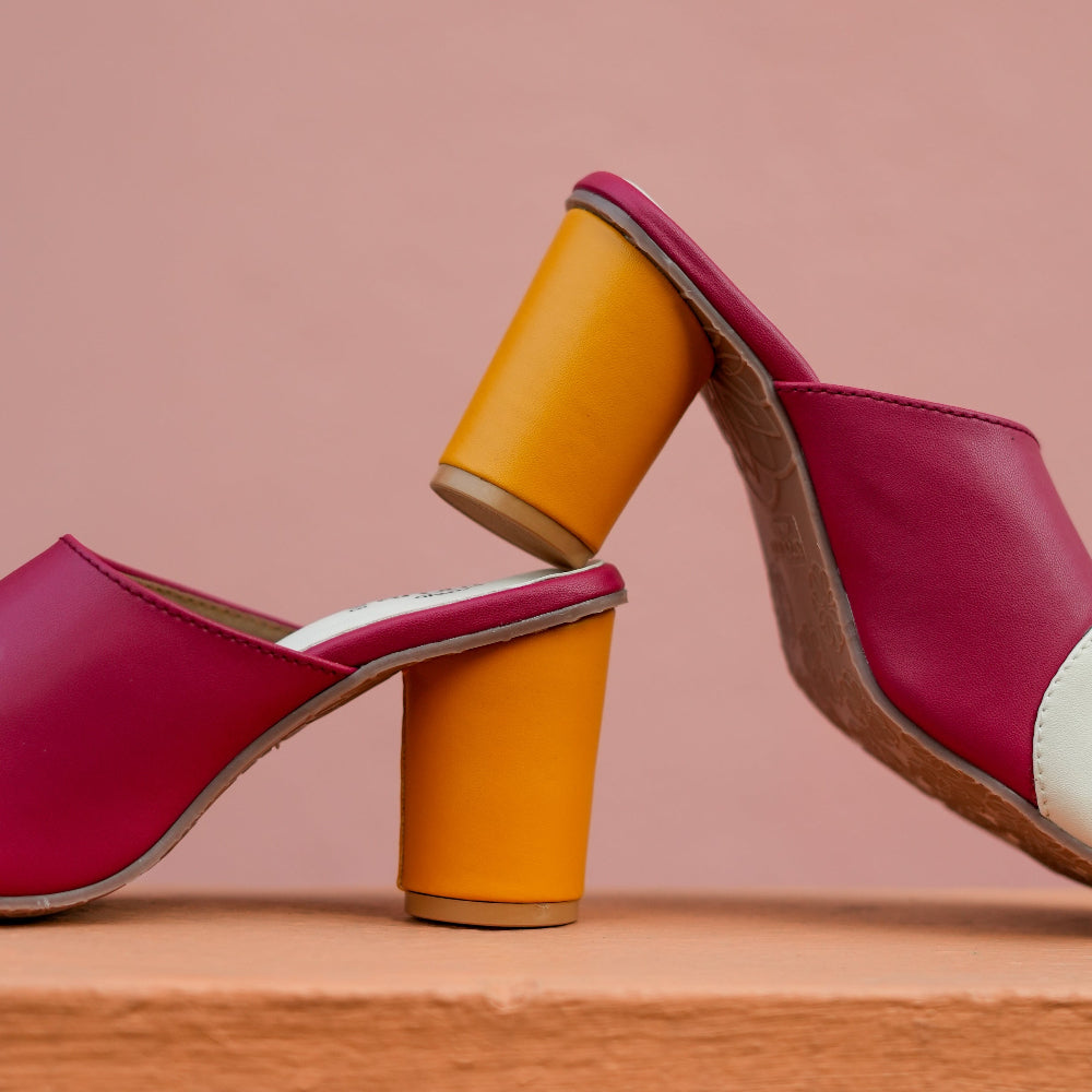 Contemporary heeled mules with pink, white, and yellow panels for elevated everyday wear