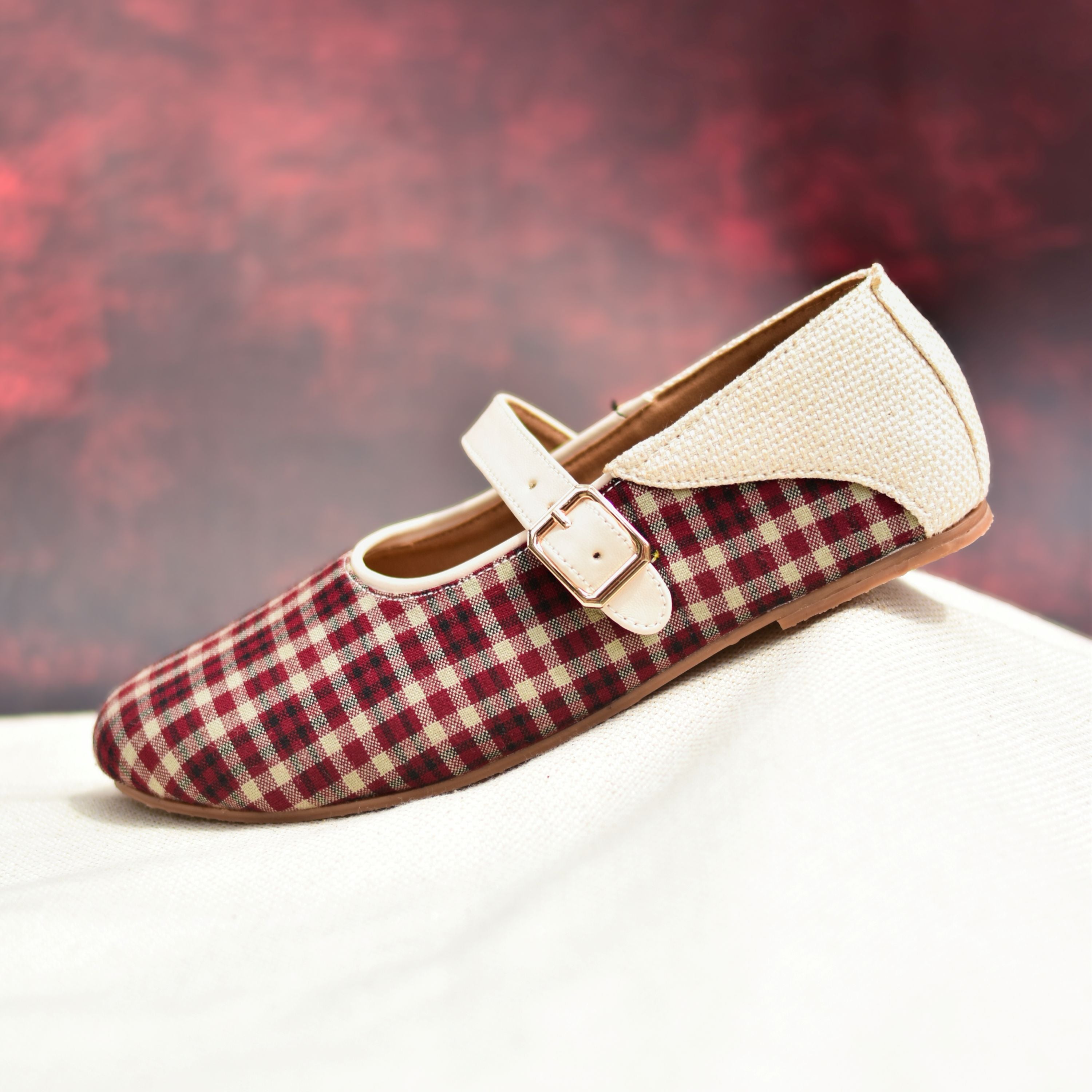 Maroon checkered flats with textured beige strap and gold buckle