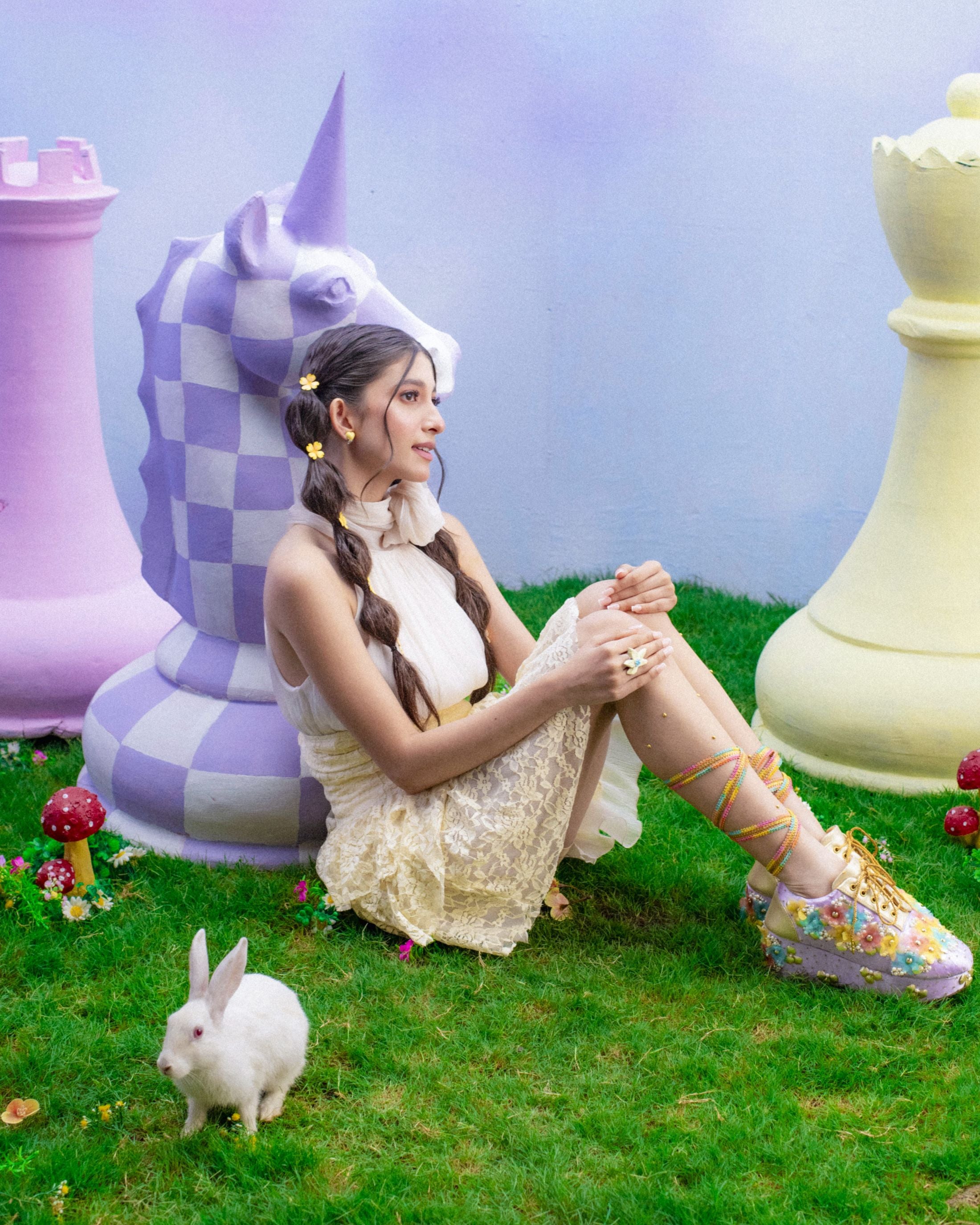 Women wearing pastel embellished lace-up shoes with textured flowers and raised sole