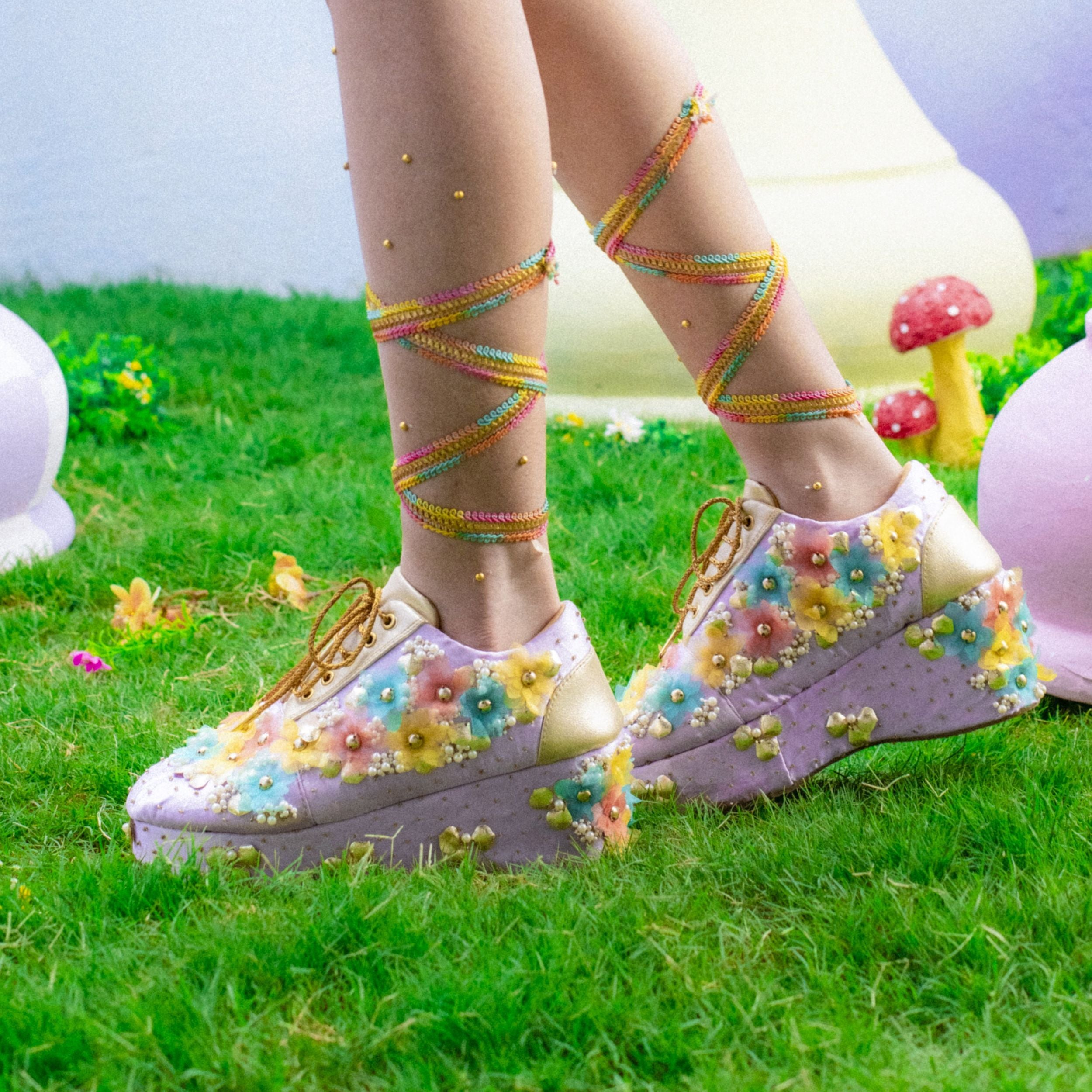 Hand embroidered lilac sneakers with multicolour floral detailing and bead embroidery.