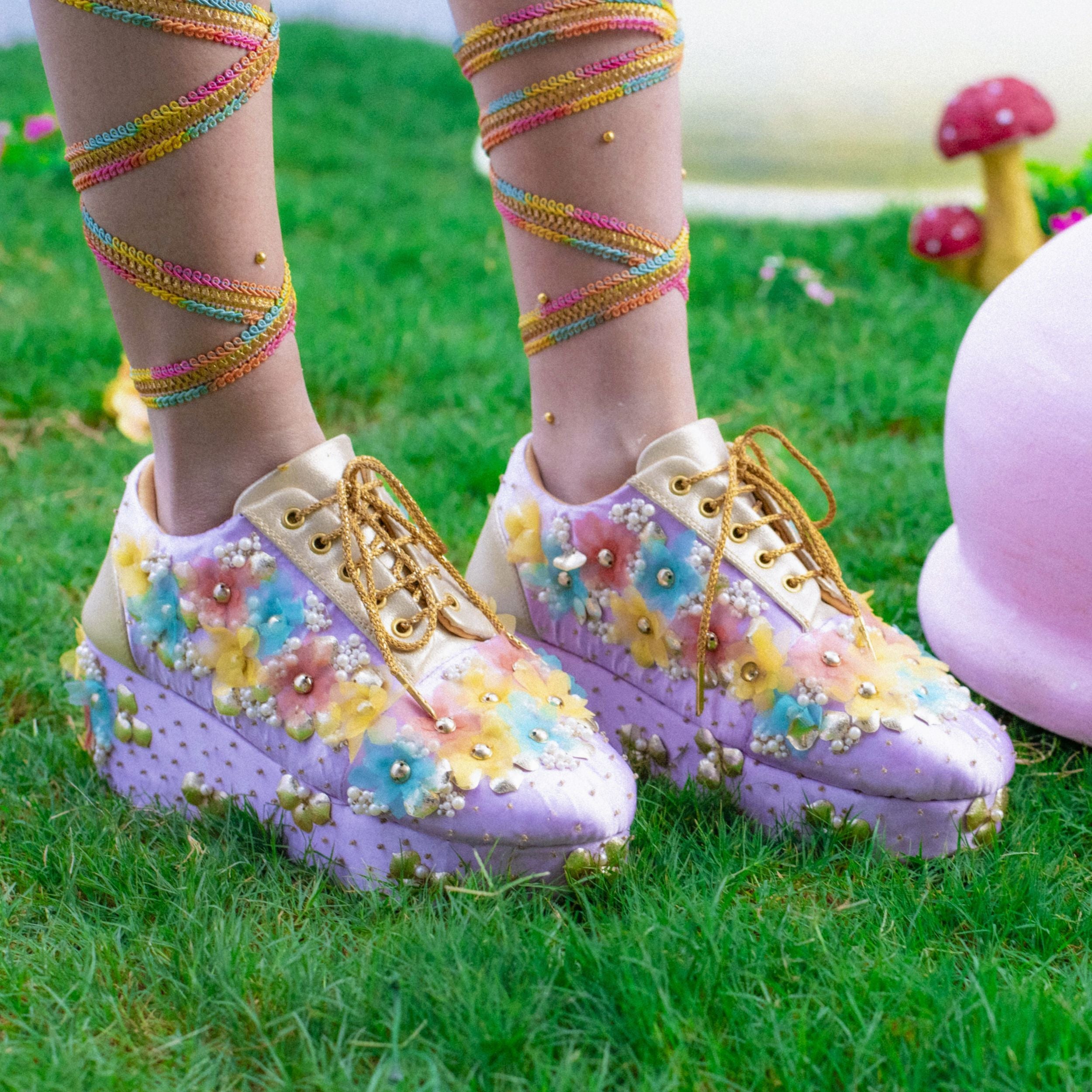 Colourful sneakers with layered floral embroidery and cushioned platform base