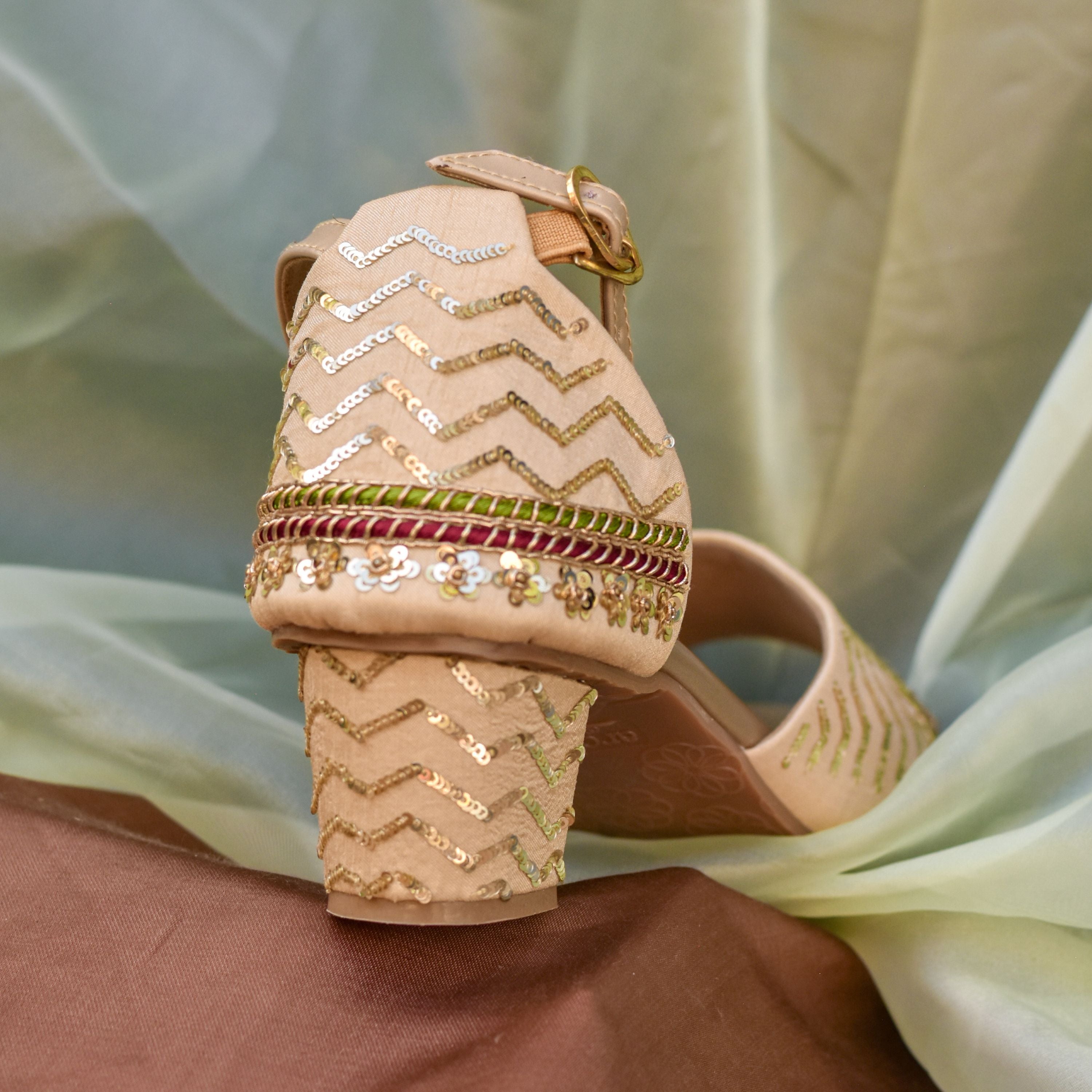 Designer block heels with shimmer embroidery and floral sequin border.