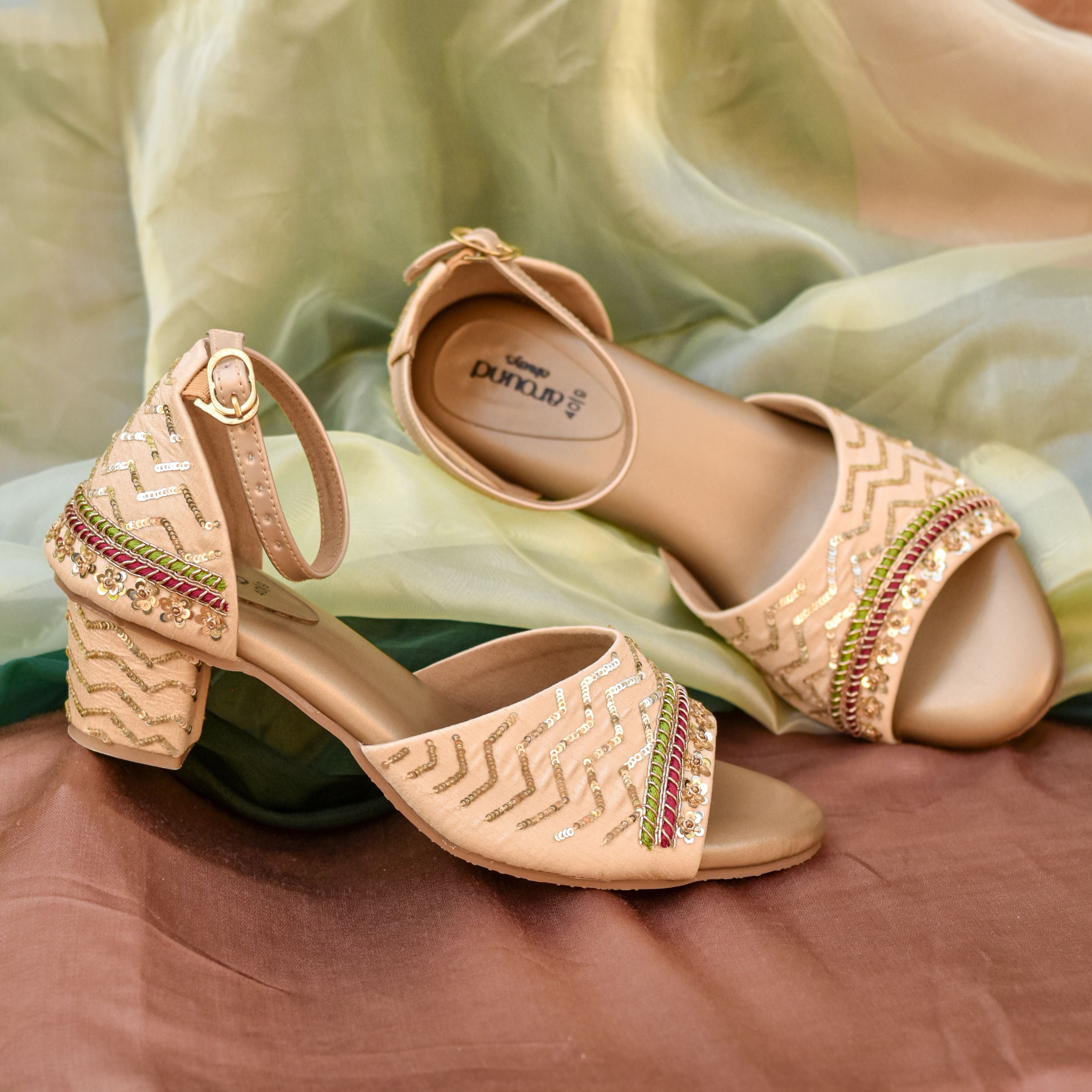 Nude block heel sandals with zig-zag sequin design and ankle strap.