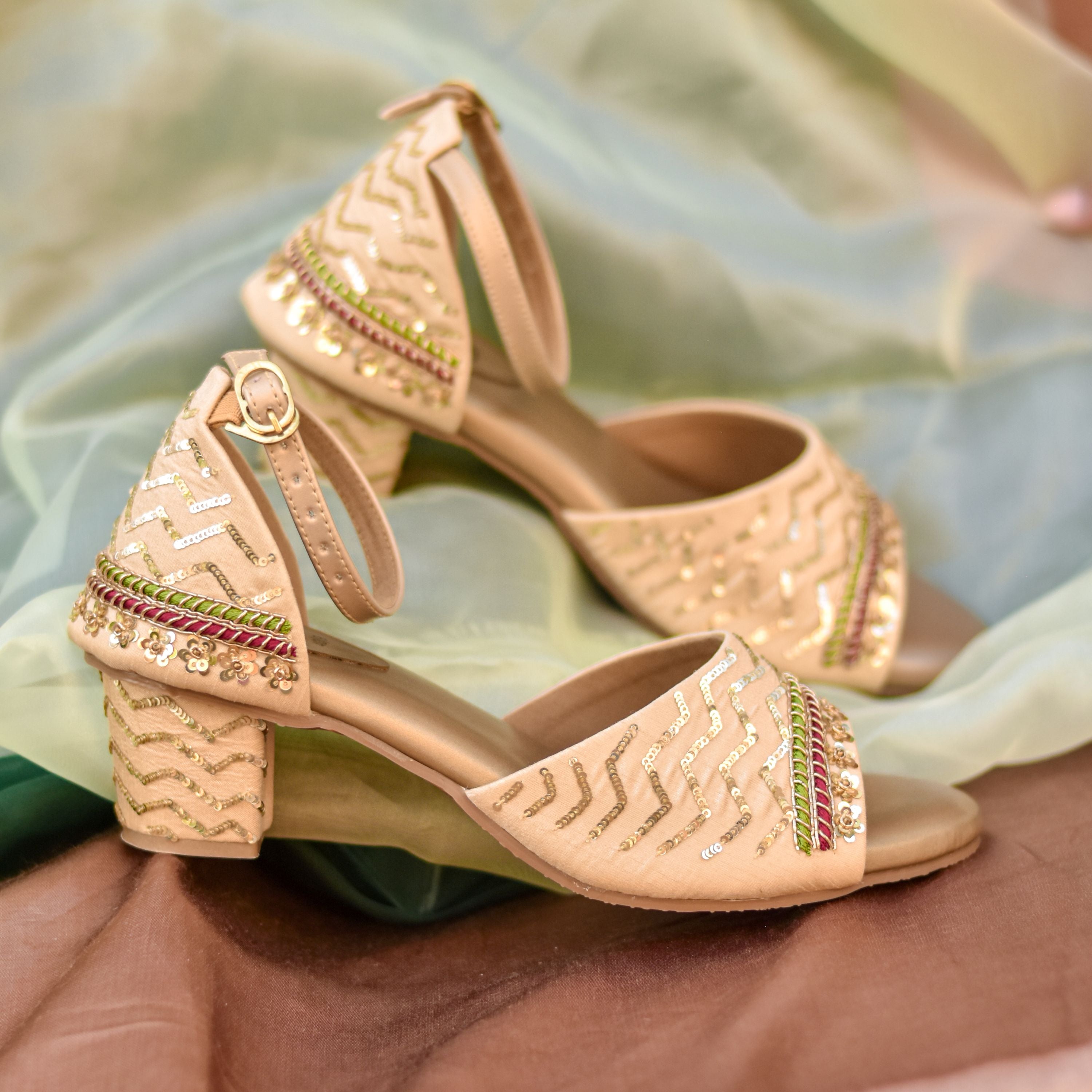 Traditional festive block heels for women with ankle buckle strap.