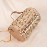 Aarzu beige barrel clutch with gold zari trellis and pearl tassels for sangeet and wedding