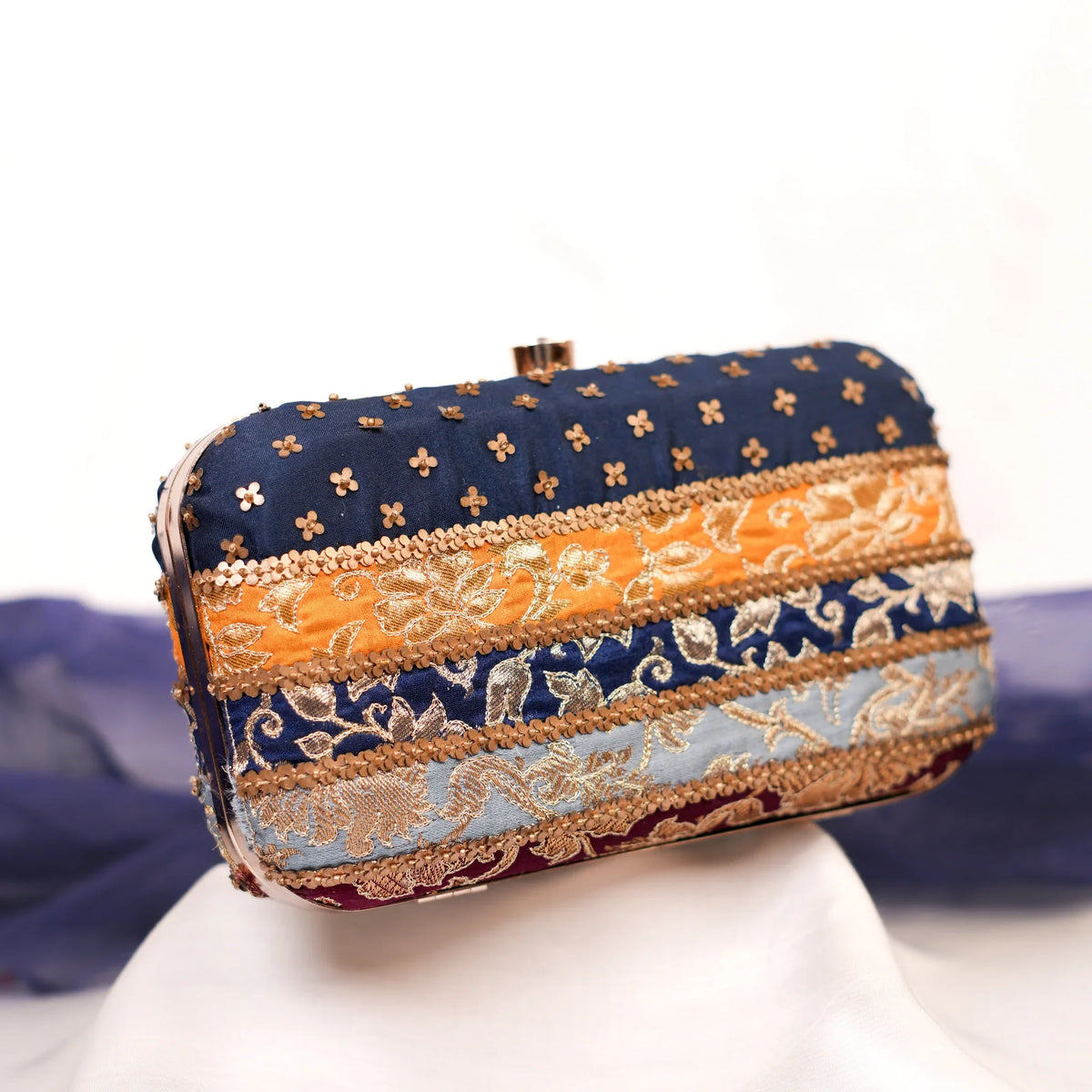 Assi multicolour brocade box clutch in navy, marigold, blue and maroon for Diwali