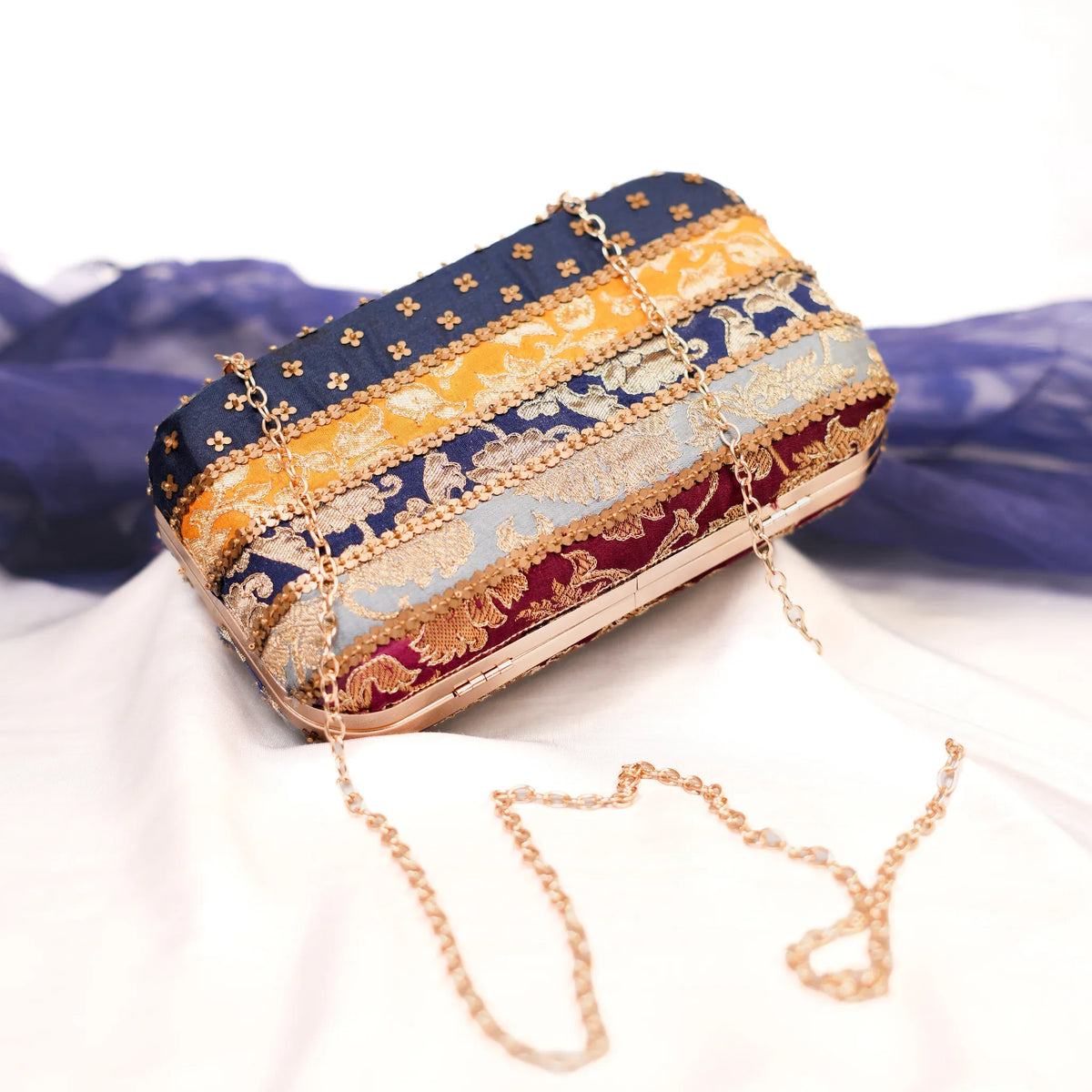 Multicolour festive clutch with detachable gold chain strap