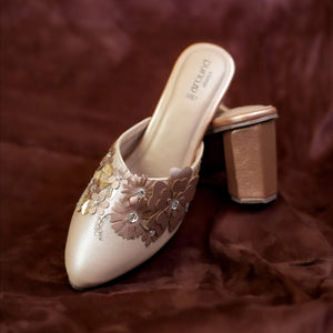 Aura champagne pointed toe mules with 3D floral embellishment and rose gold block heel by Around Always